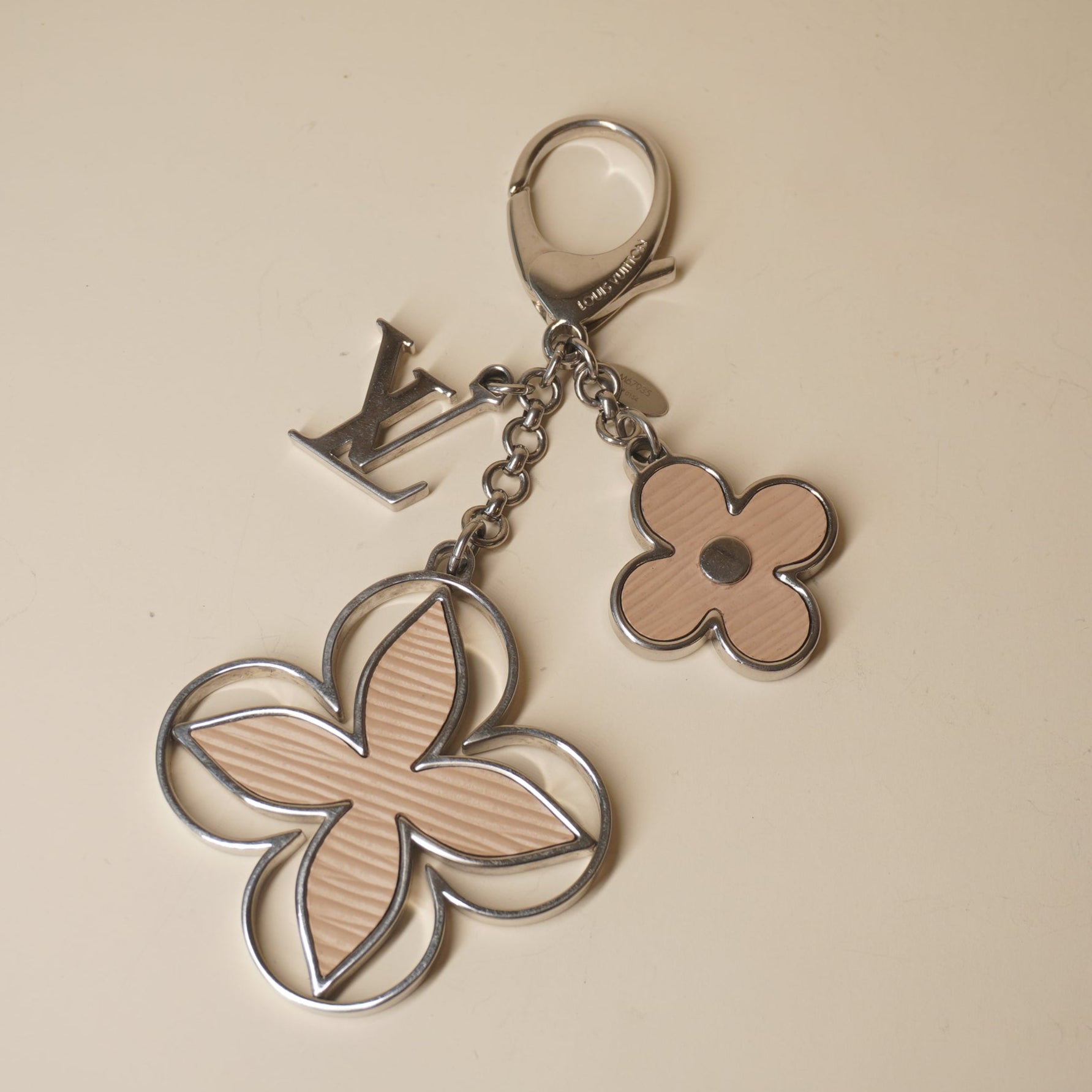 PRE-OWNED Epi Rimy Beige Bag Charm 