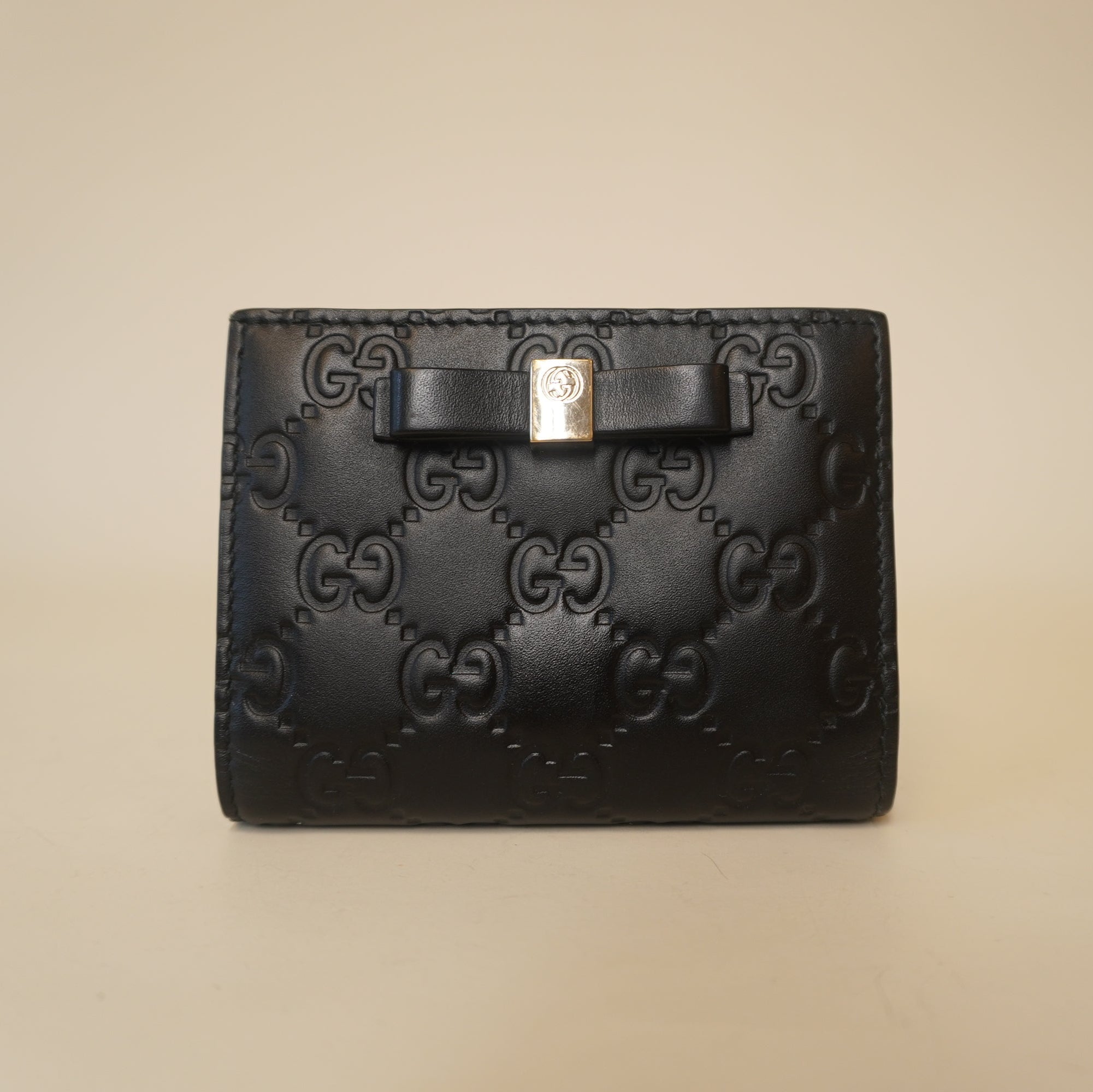 PRE-OWNED GG Black Guccissima Bow Bifold Wallet