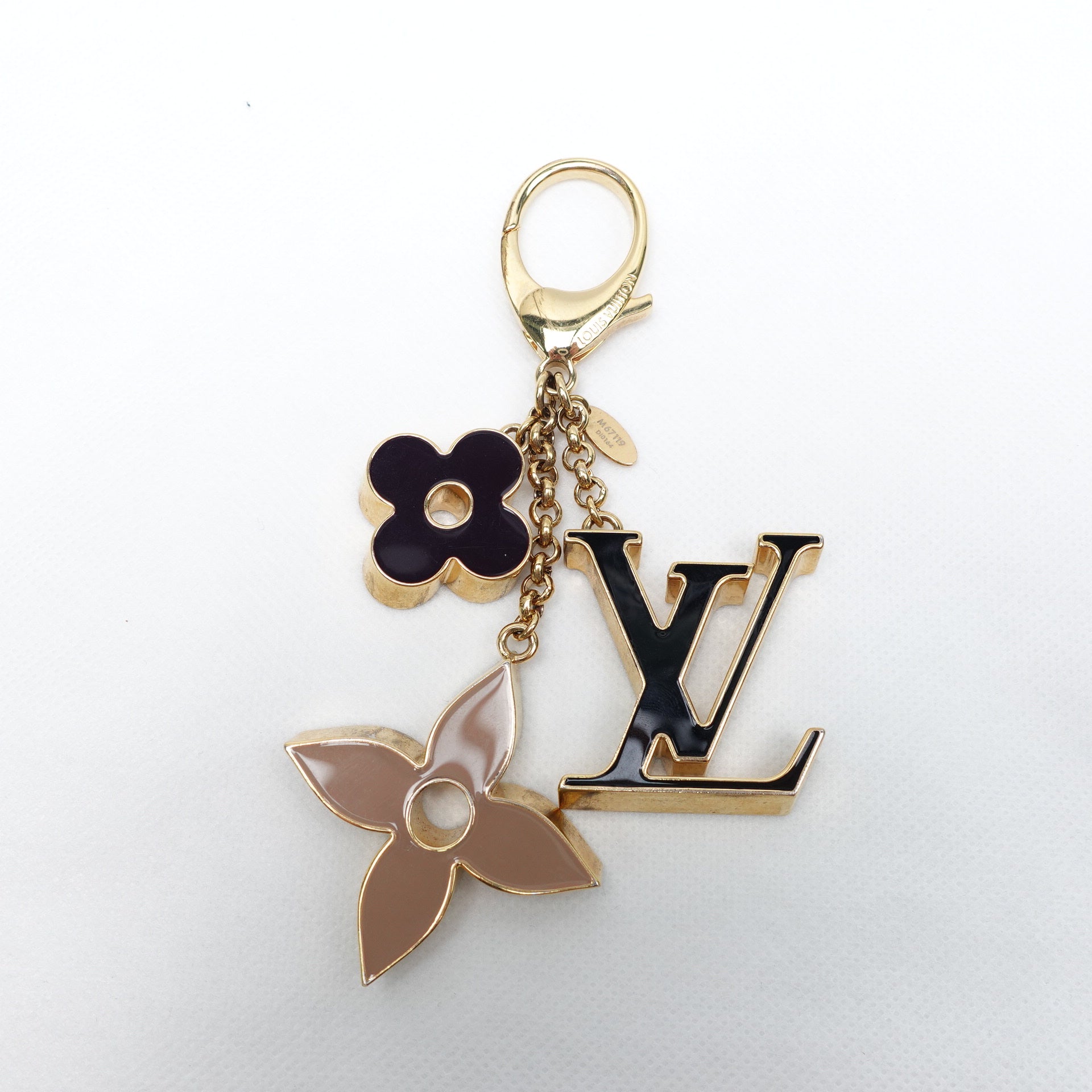 Llavero y dije para bolso con monograma Fleur de LV USADO