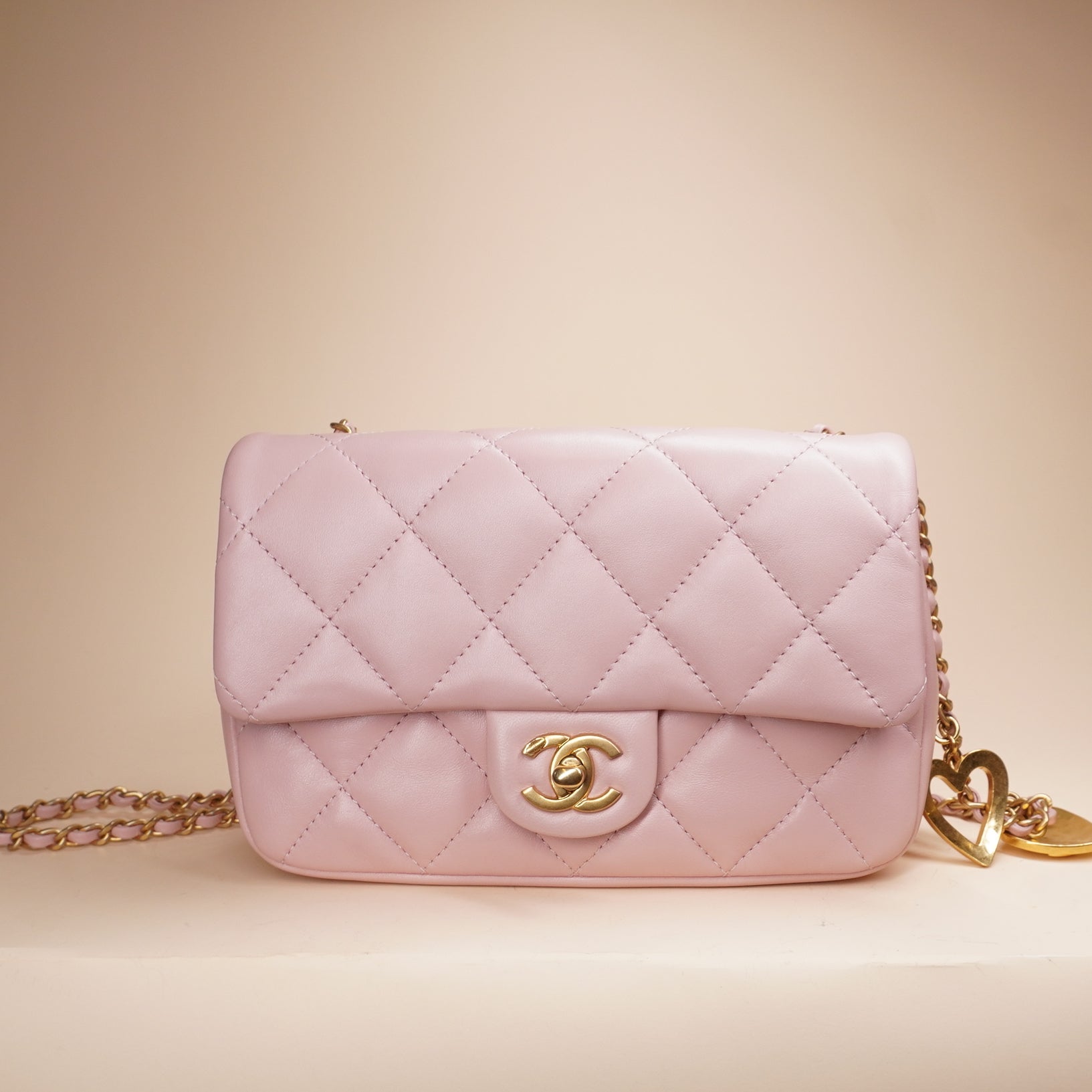 PRE-OWNED CC Pink Lambskin Quilted Mini Heart Charms Flap Crossbody Bag