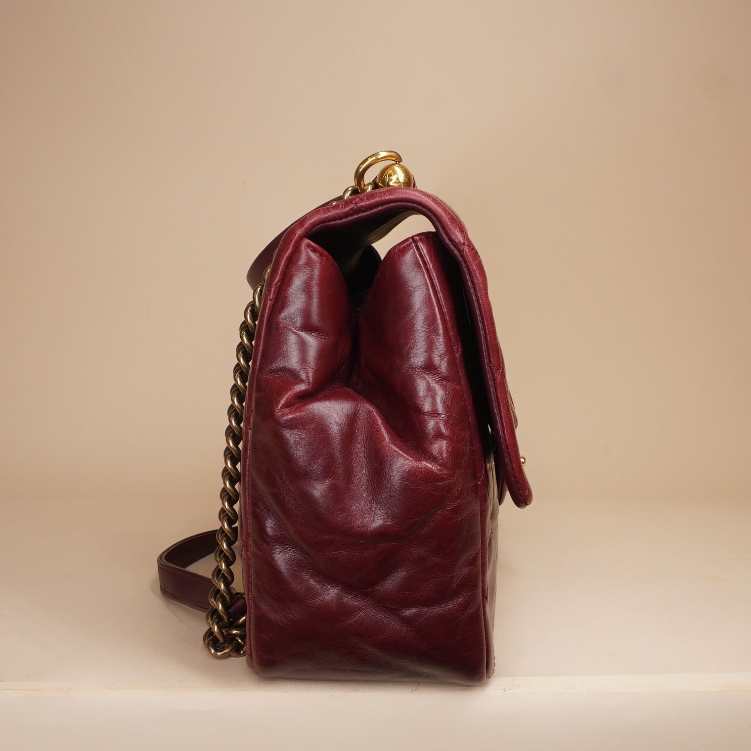 PRE-OWNED CC Burgundy Aged Leather Gold Bar Top Handle Bag