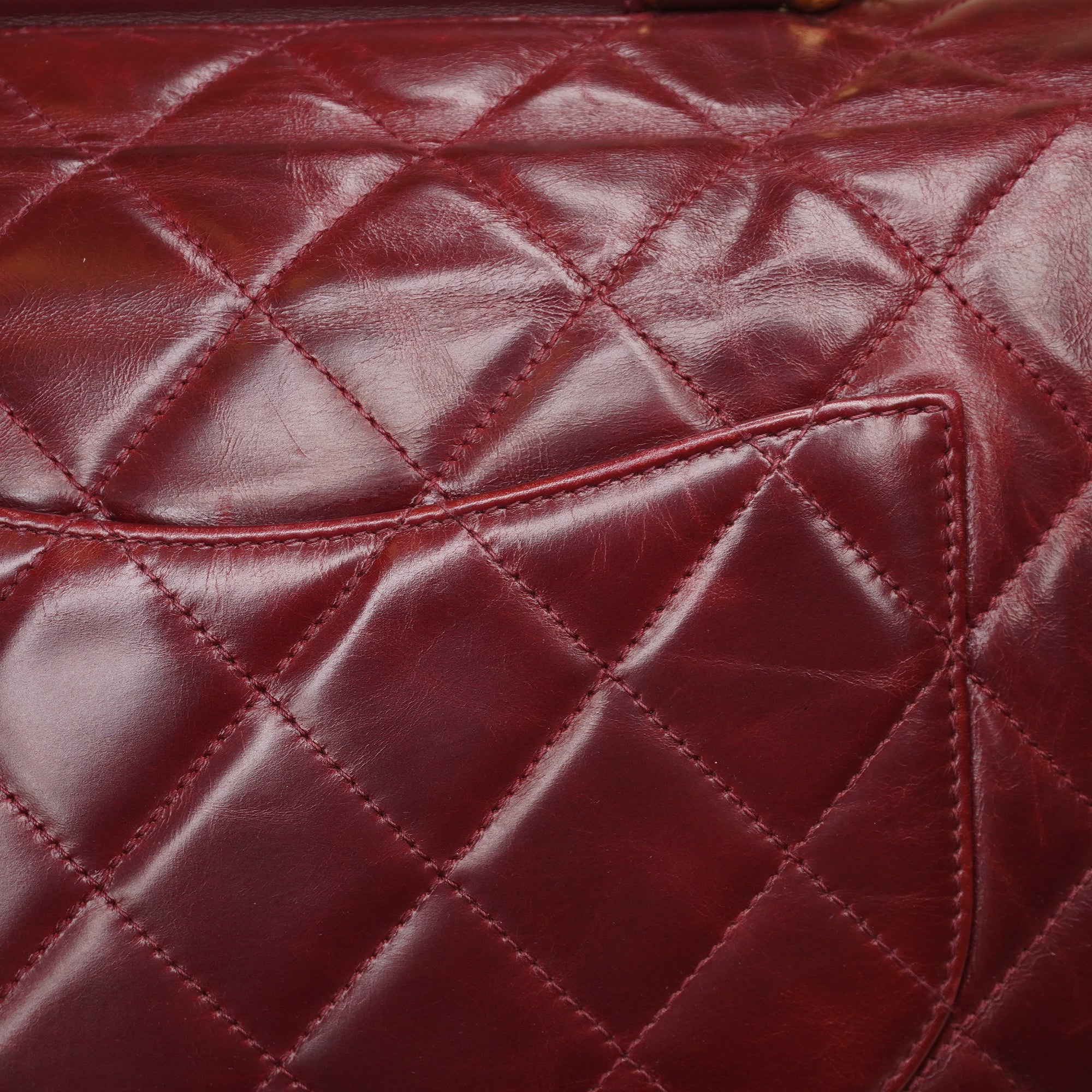 PRE-OWNED CC Burgundy Aged Leather Gold Bar Top Handle Bag