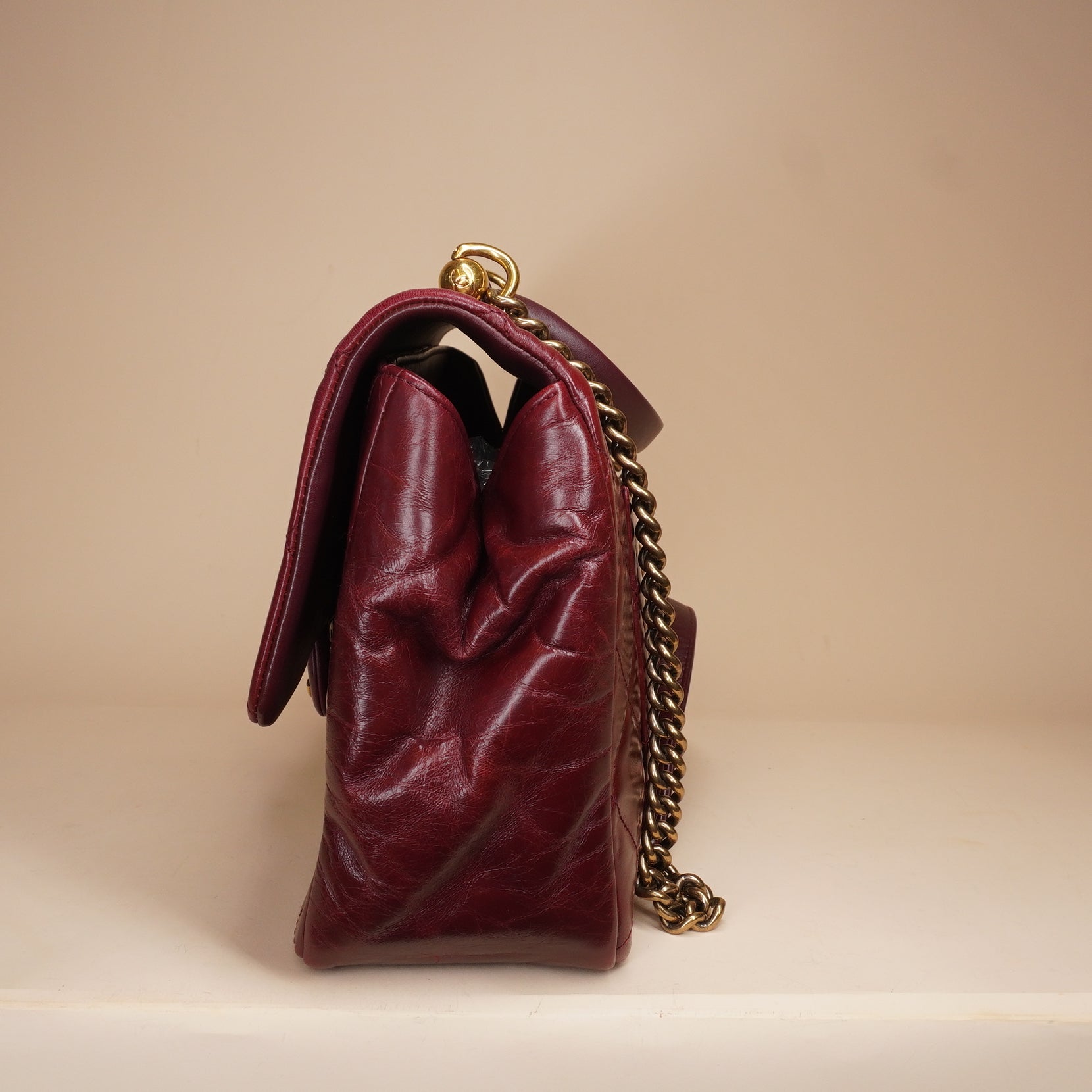 PRE-OWNED CC Burgundy Aged Leather Gold Bar Top Handle Bag