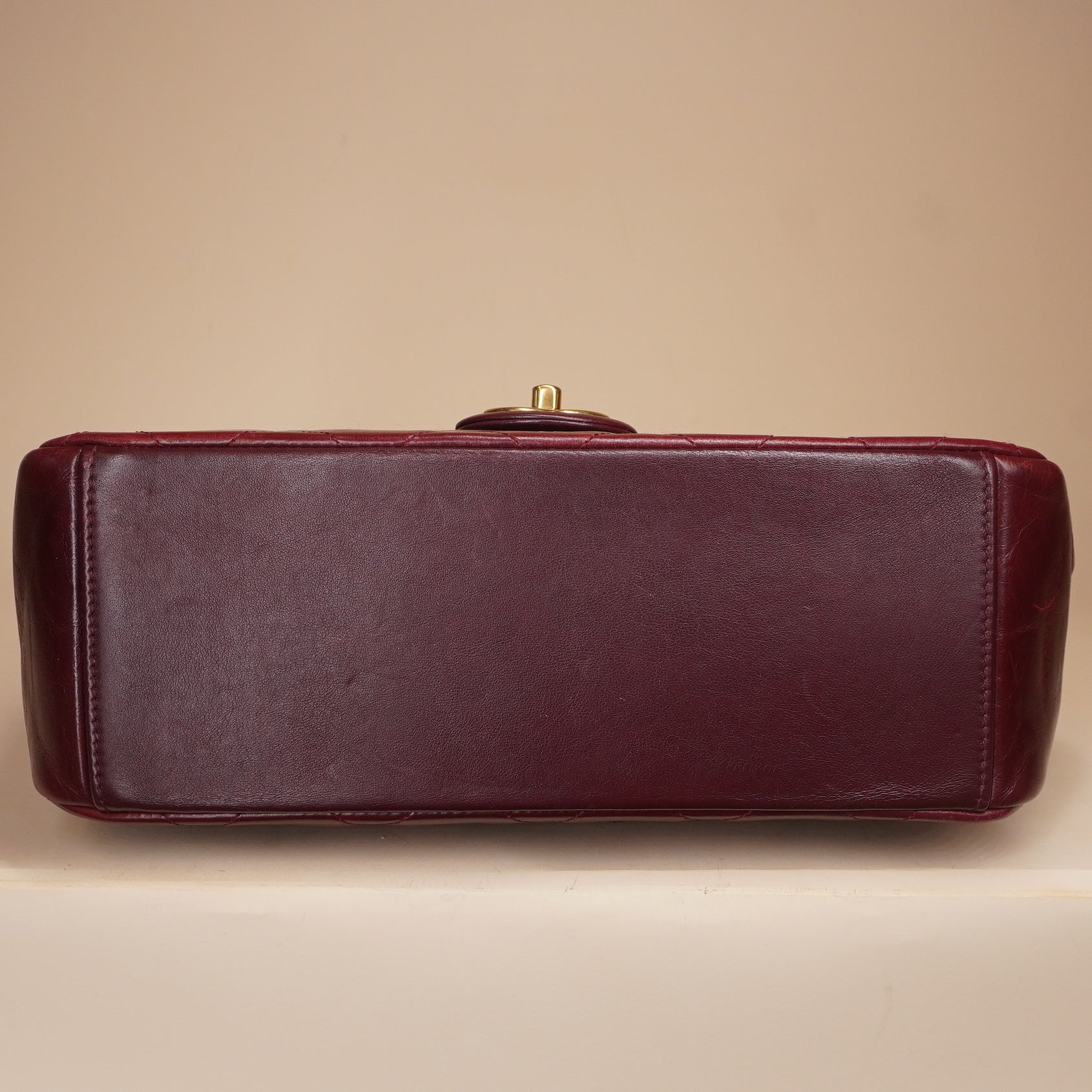 PRE-OWNED CC Burgundy Aged Leather Gold Bar Top Handle Bag
