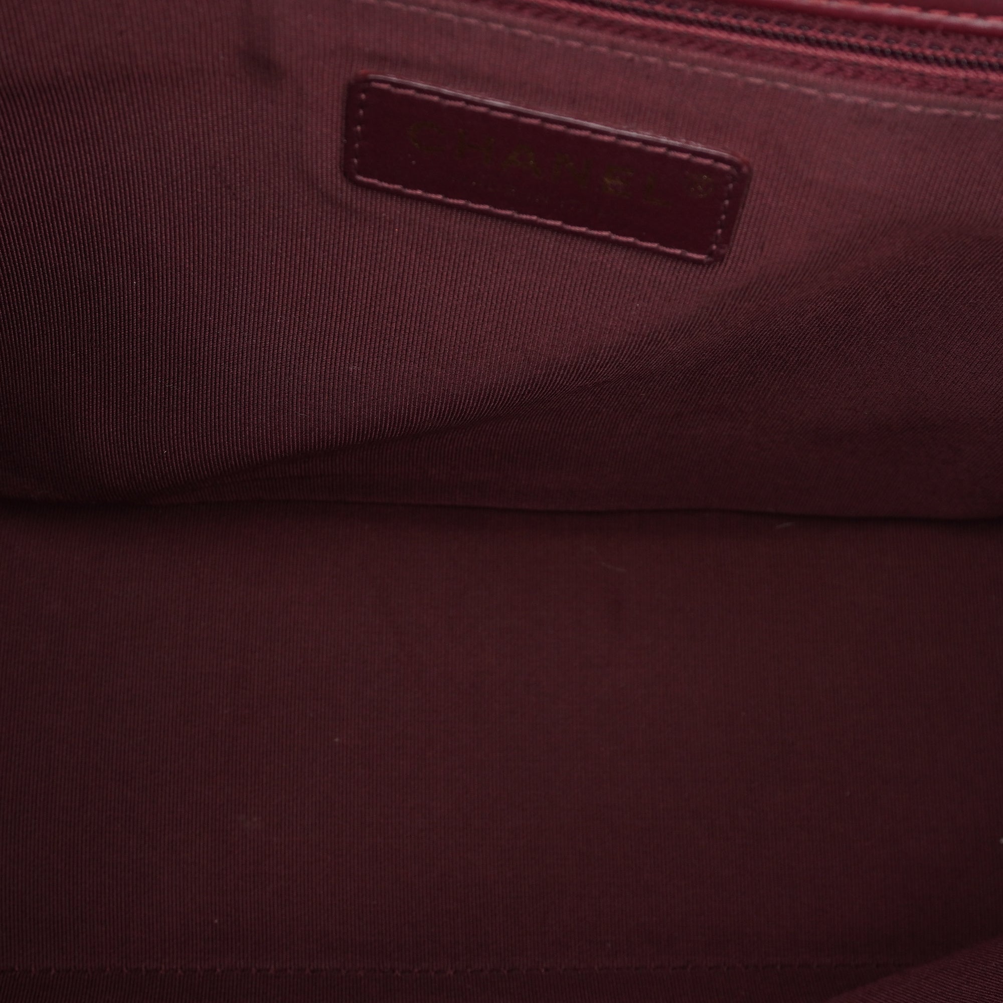 PRE-OWNED CC Burgundy Aged Leather Gold Bar Top Handle Bag