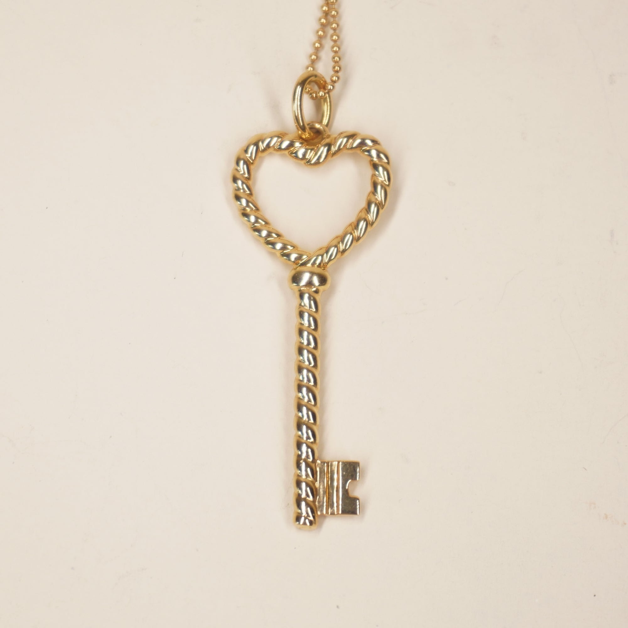 PRE-OWNED Twisted heart key 18K Yellow Gold Necklace