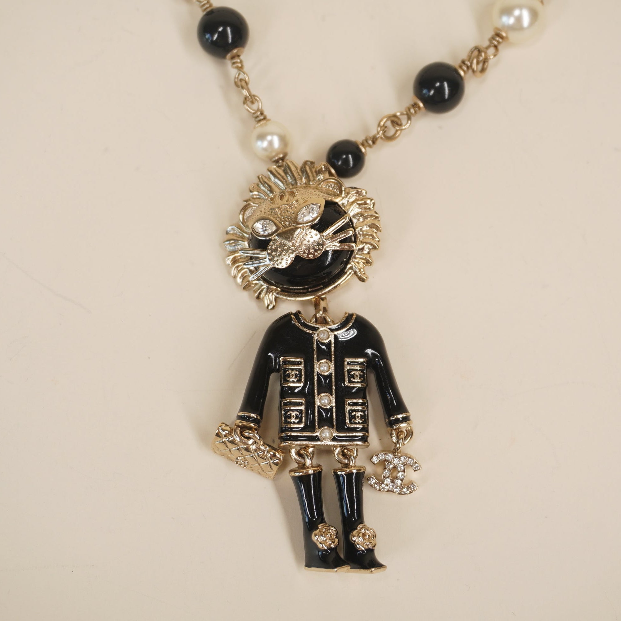 PRE-OWNED CC Enamel Crystal Pearl CC Lion Hardware Necklace