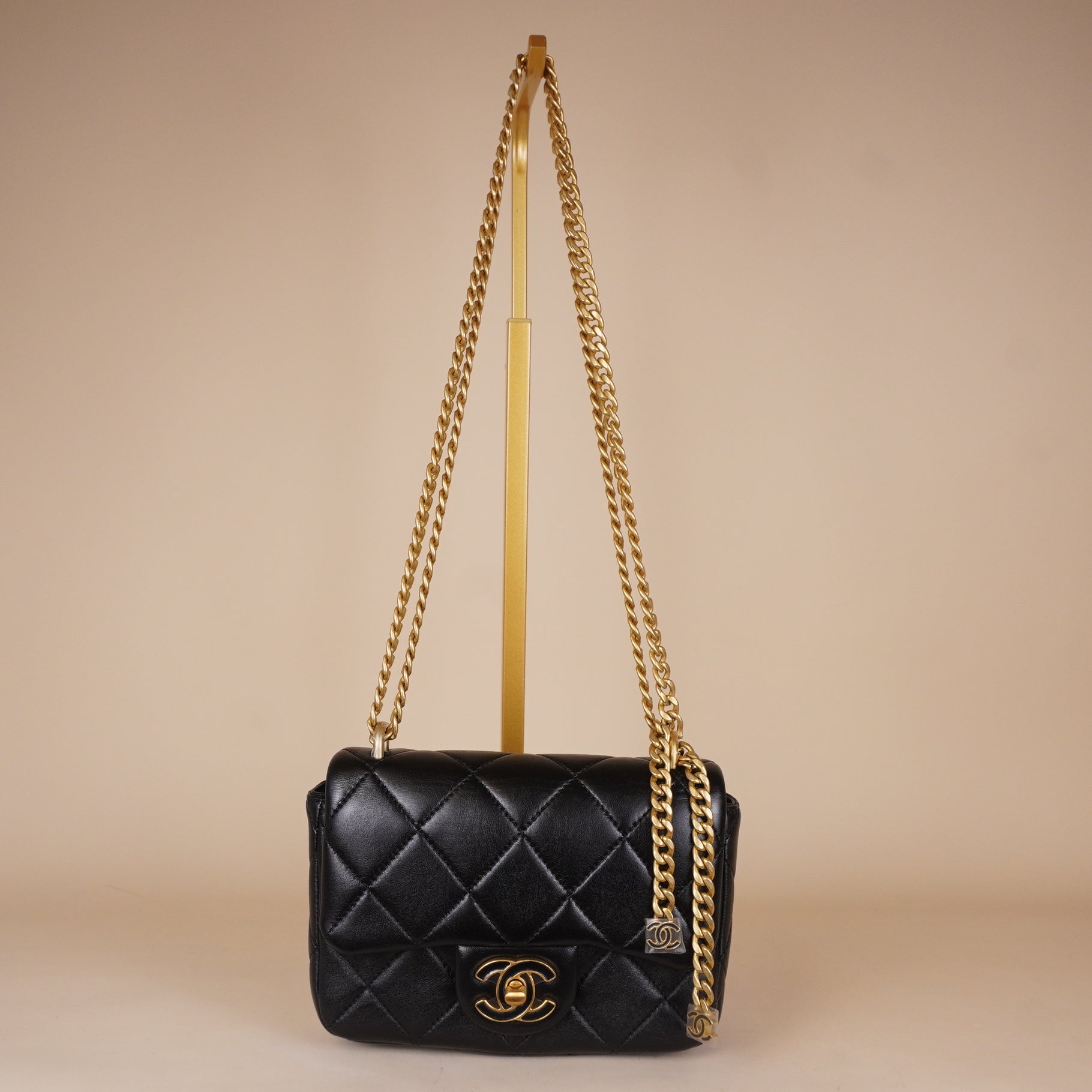 PRE-OWNED Black Quilted Lambskin Mini Flap Bag Gold and Enamel Hardware
