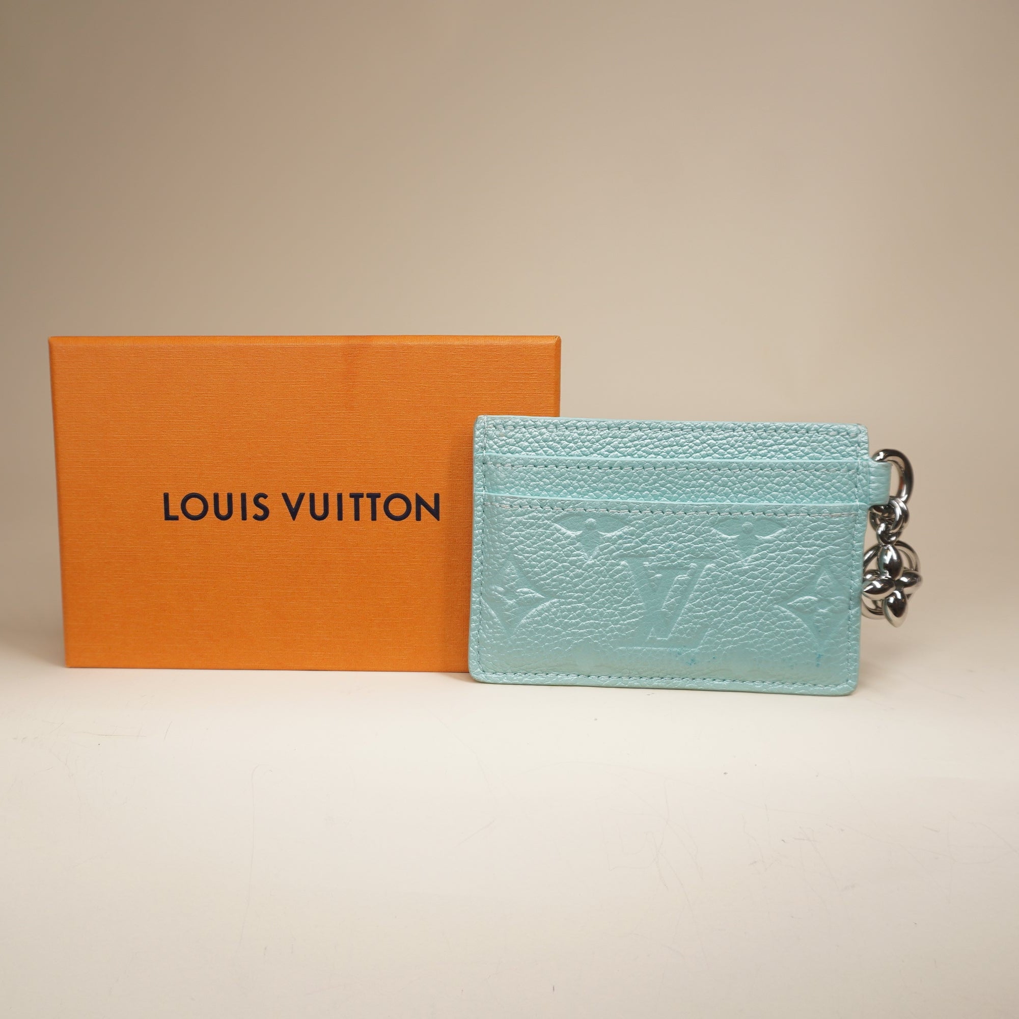 PRE-OWNED LV Lagoon Turquoise Empreinte Monogram LV Charms Card Holder Pearly