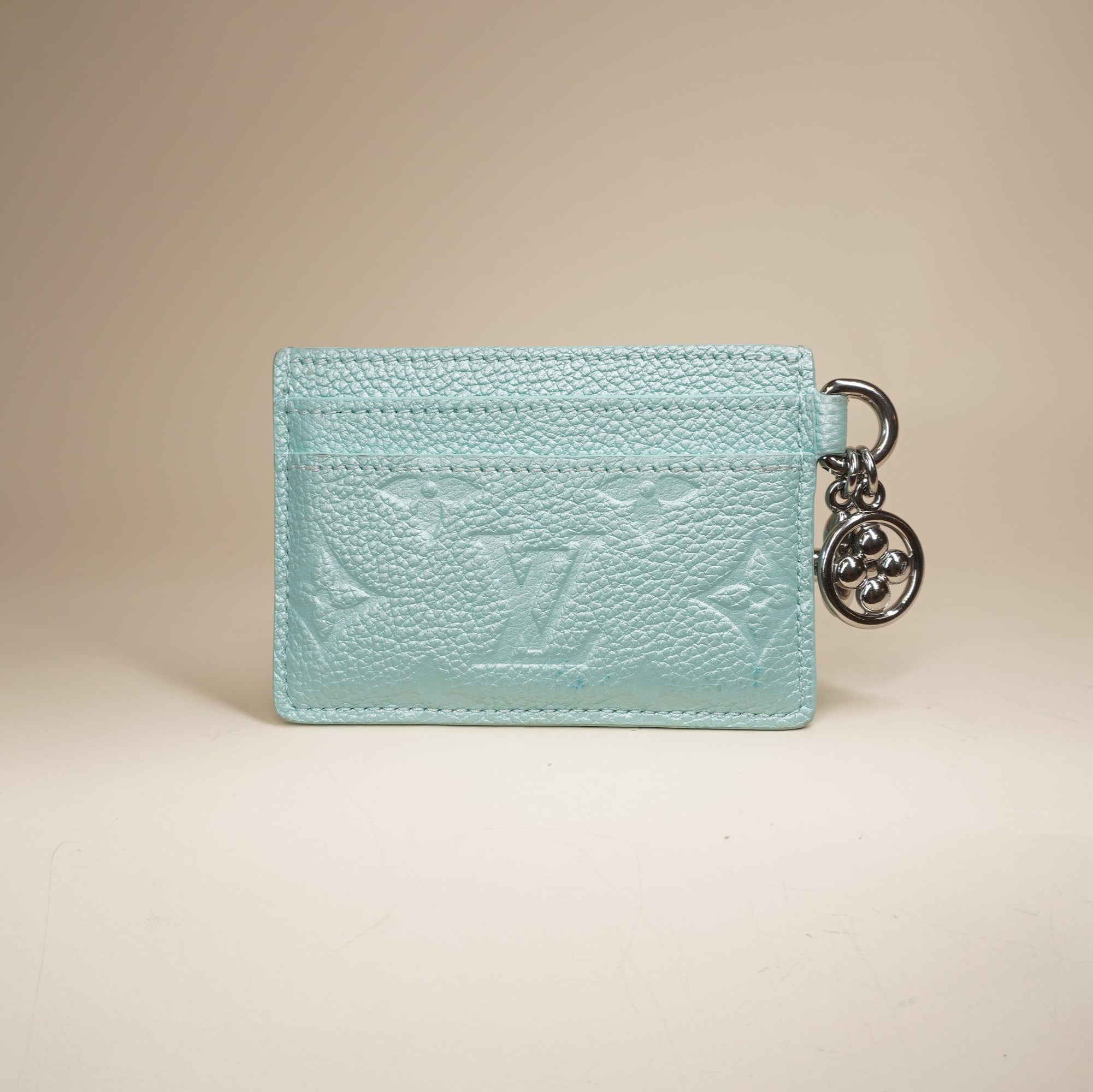 PRE-OWNED LV Lagoon Turquoise Empreinte Monogram LV Charms Card Holder Pearly