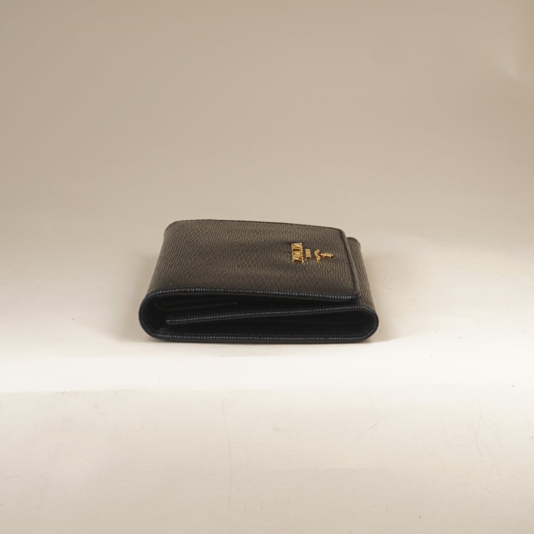 PRE-OWNED Vitello Move Bi-Fold Wallet Black