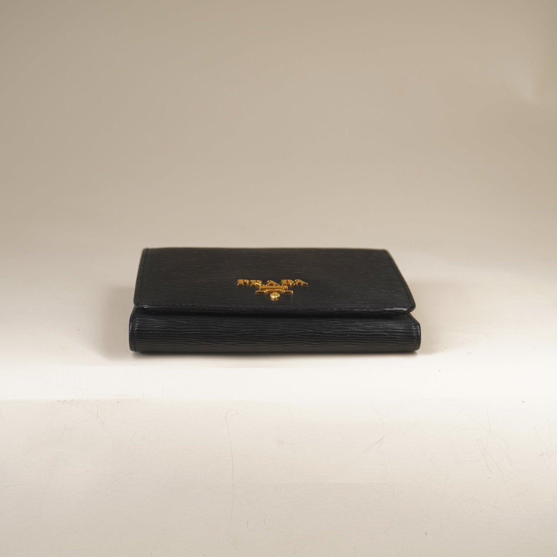 PRE-OWNED Vitello Move Bi-Fold Wallet Black