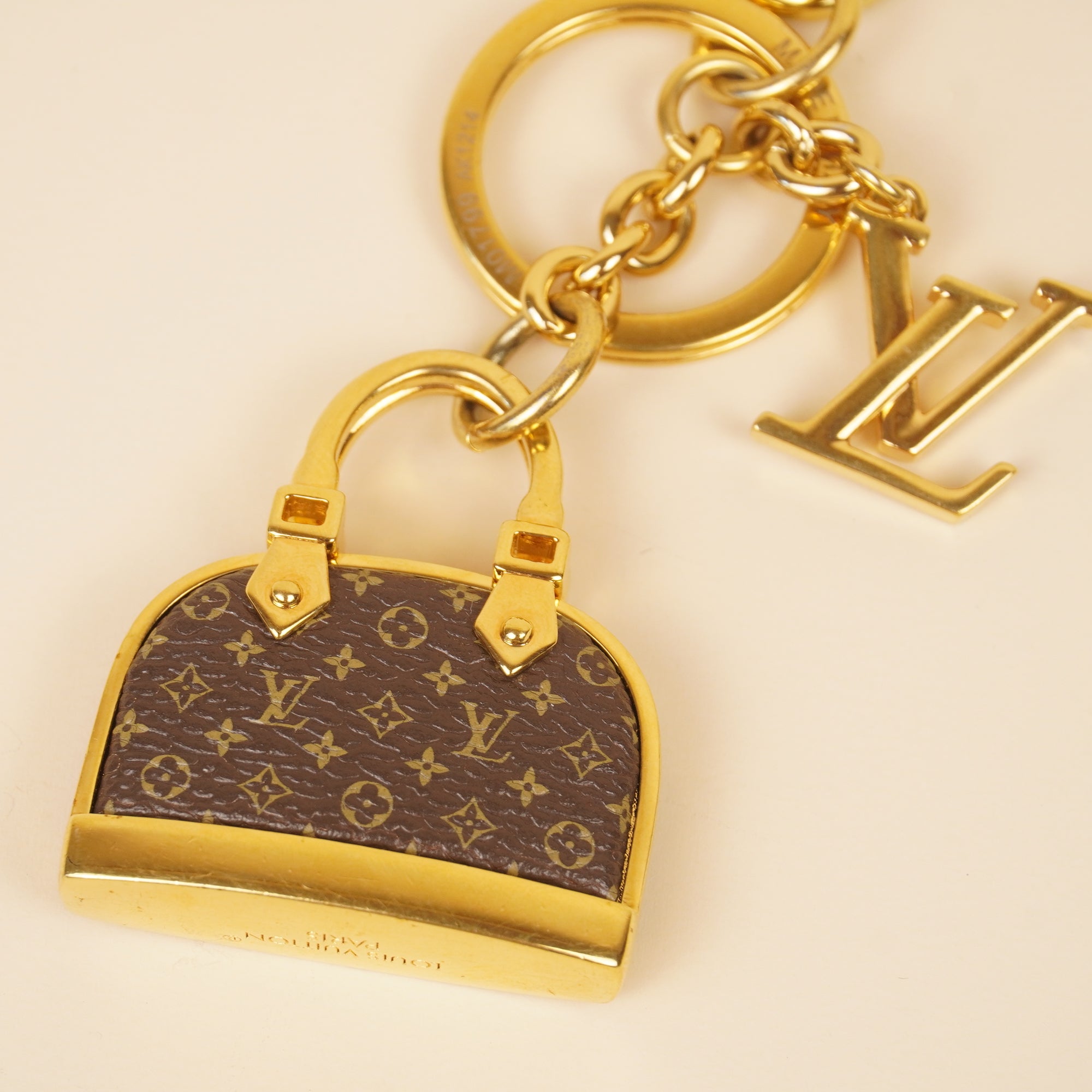 PRE-OWNED LV Monogram Iconic Alma Bag Charm