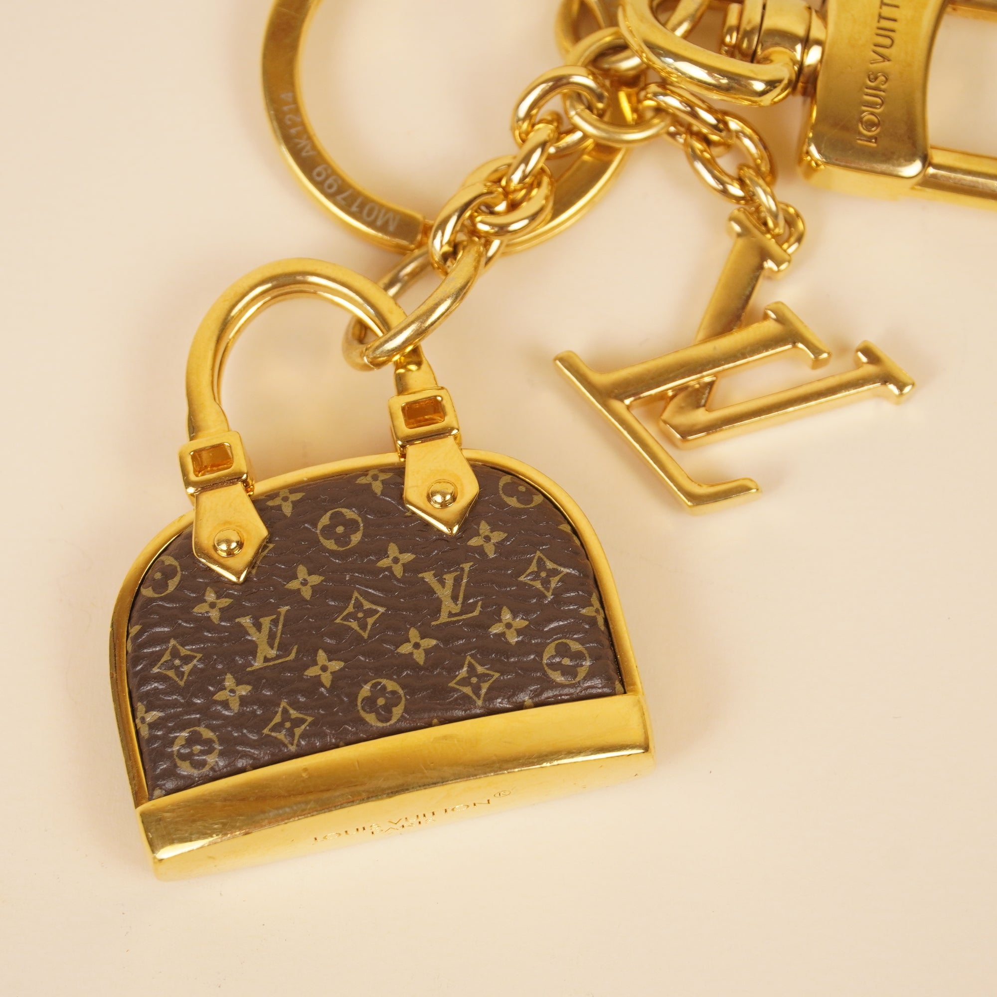 PRE-OWNED LV Monogram Iconic Alma Bag Charm
