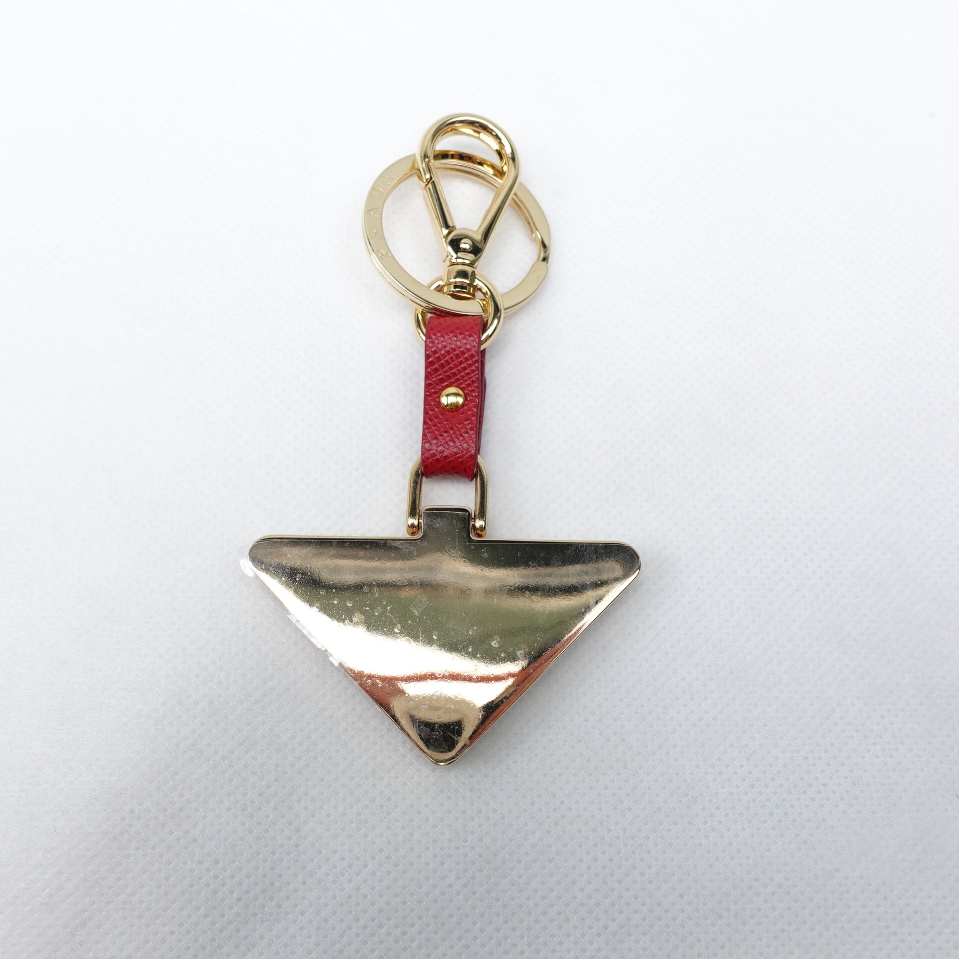 PRE-OWNED Red Triangle Bag Charm