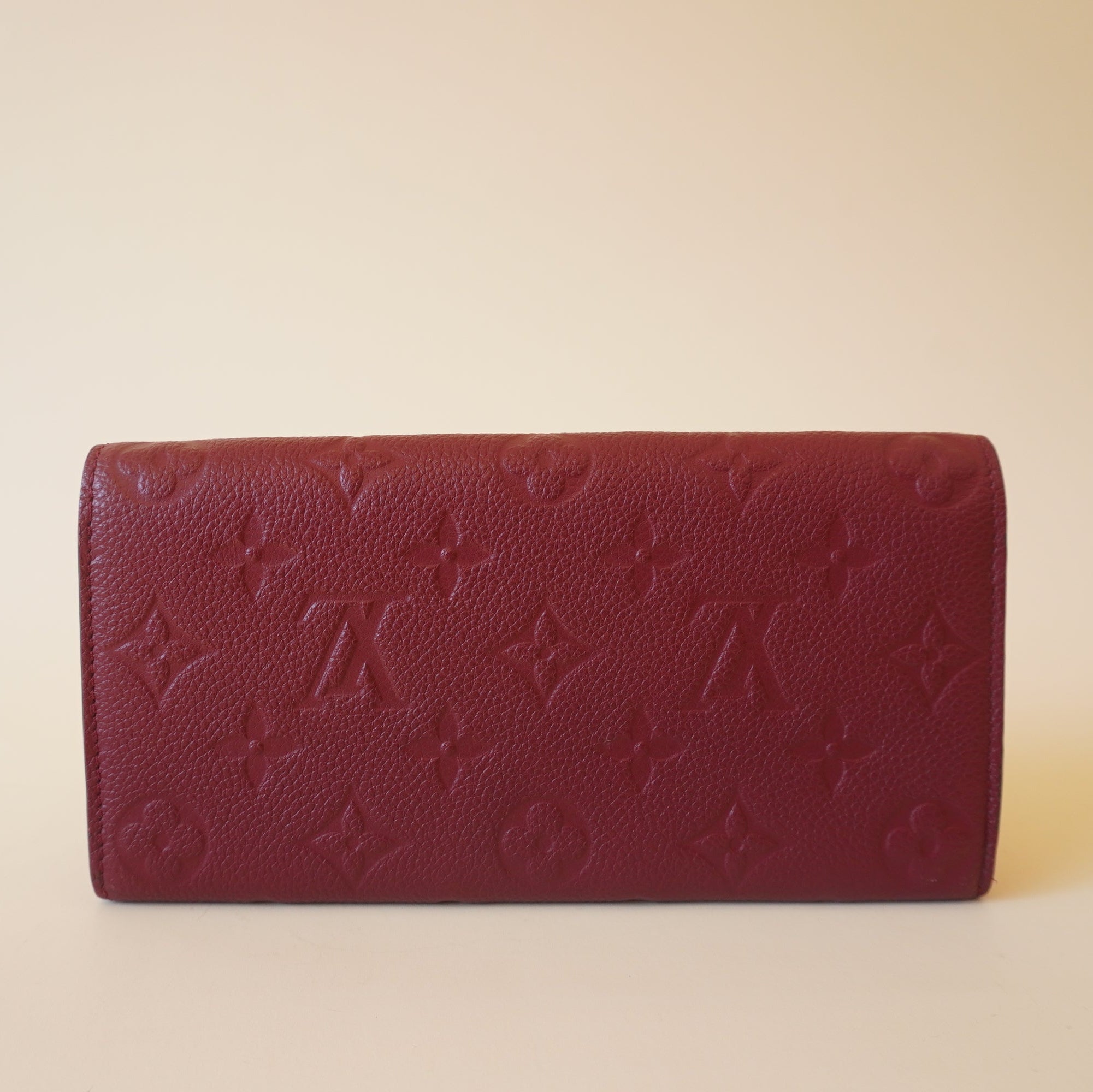 Cartera LV Empreinte Emilie en color burdeos de segunda mano con pasas