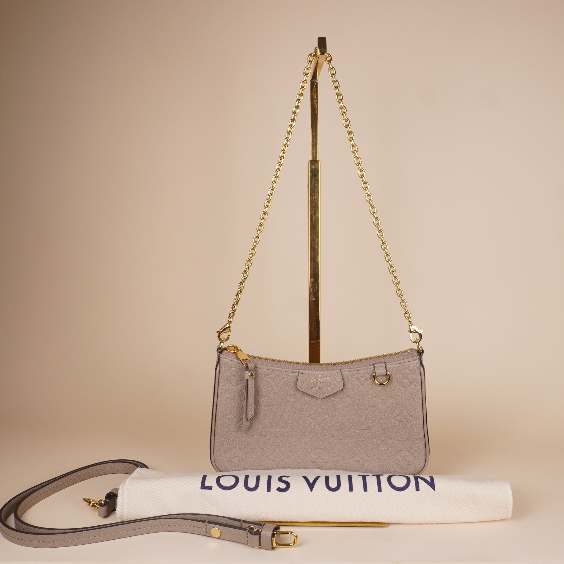 PRE-OWNED LV Empreinte Easy Pouch On Strap Tourterelle