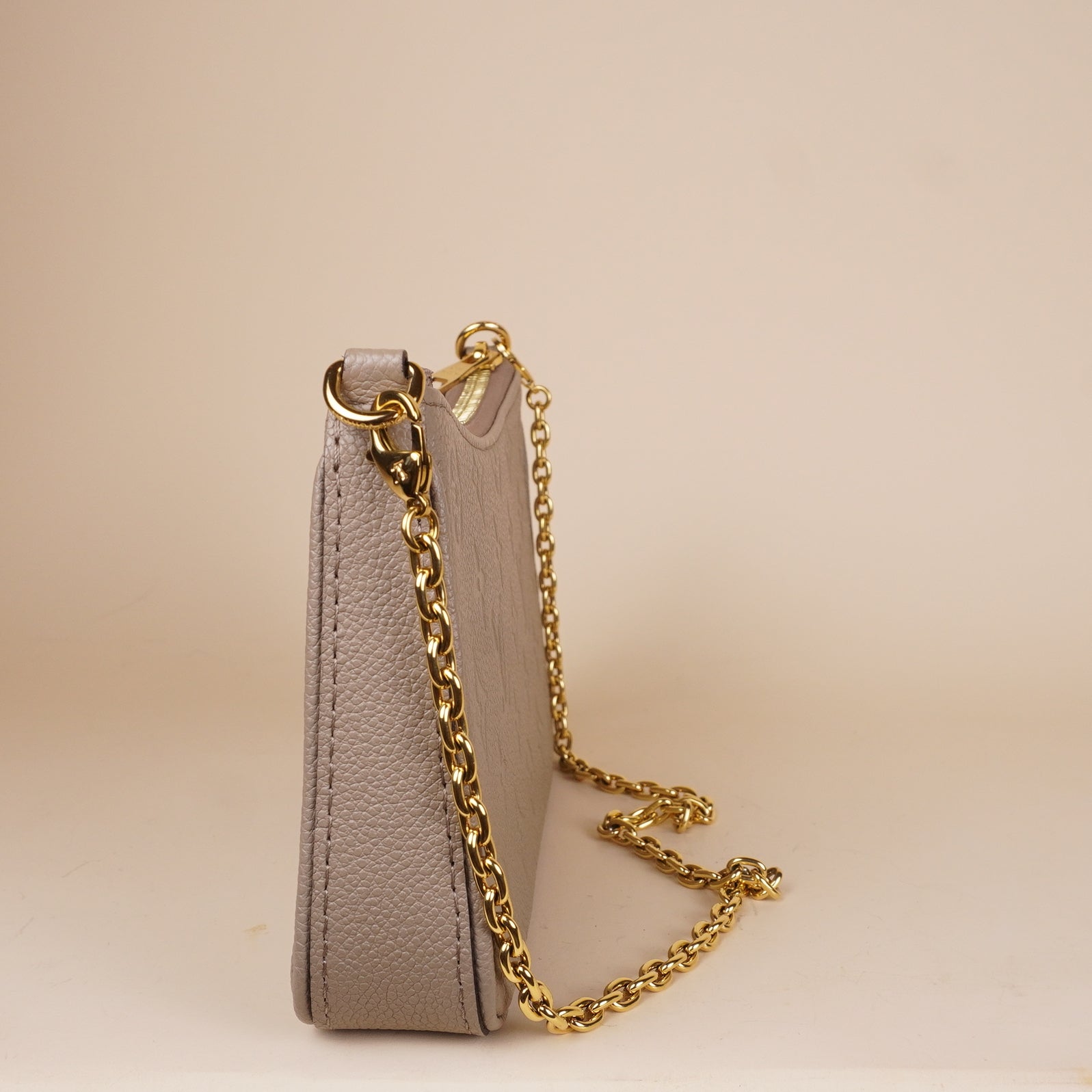PRE-OWNED LV Empreinte Easy Pouch On Strap Tourterelle