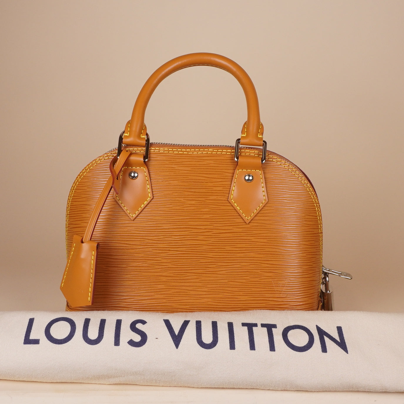 PRE-OWNED LV Epi Jacquard Alma BB Honey Gold