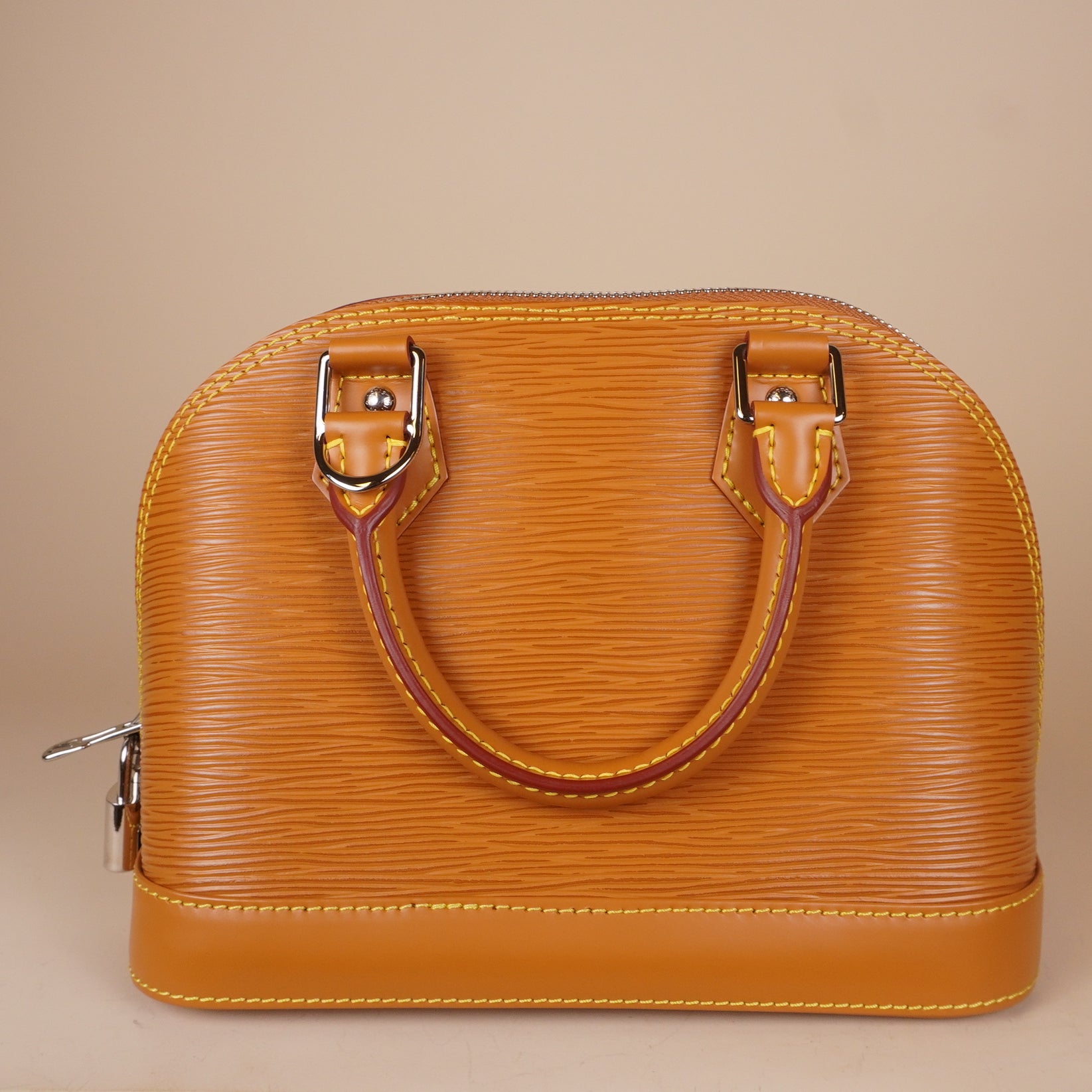 PRE-OWNED LV Epi Jacquard Alma BB Honey Gold