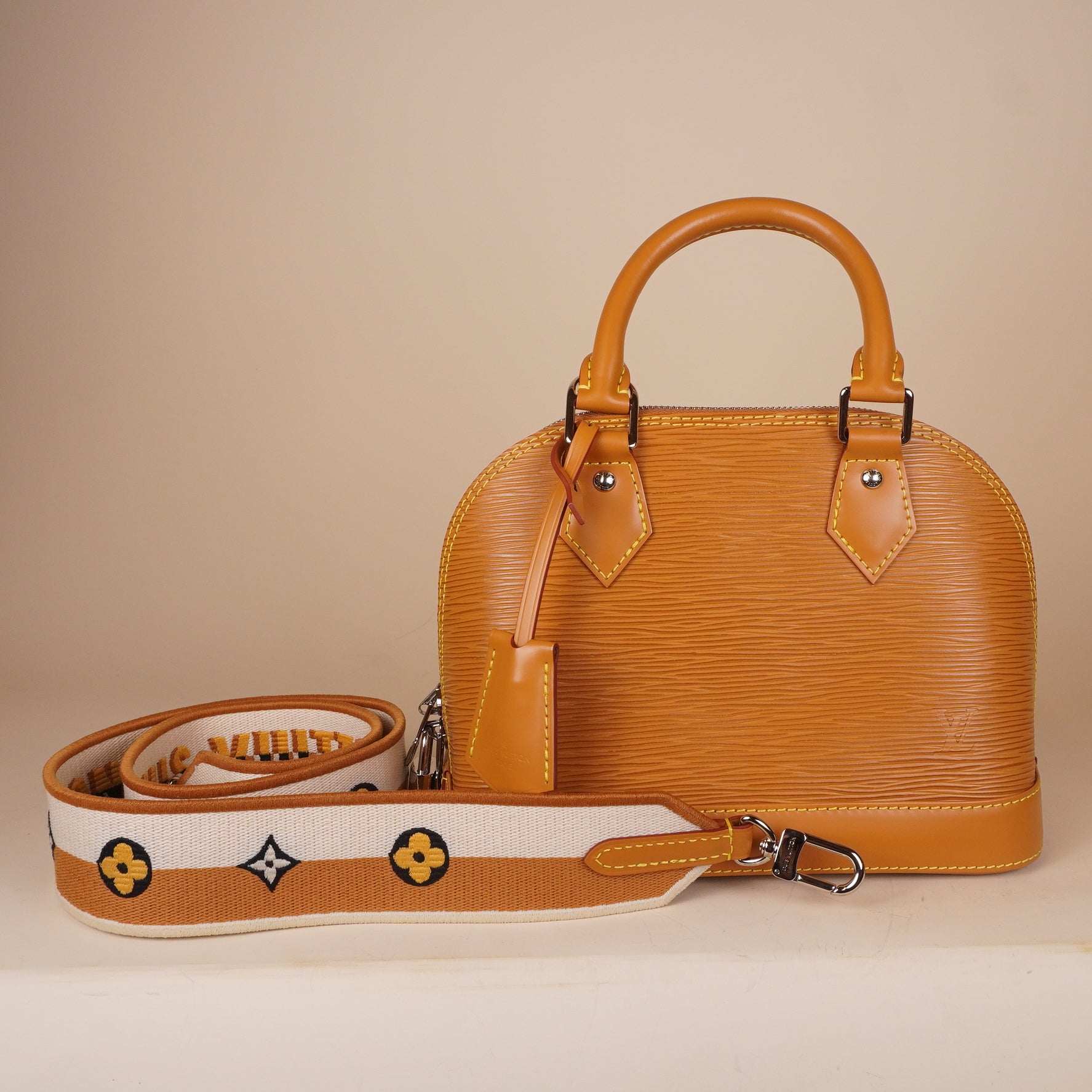 PRE-OWNED LV Epi Jacquard Alma BB Honey Gold