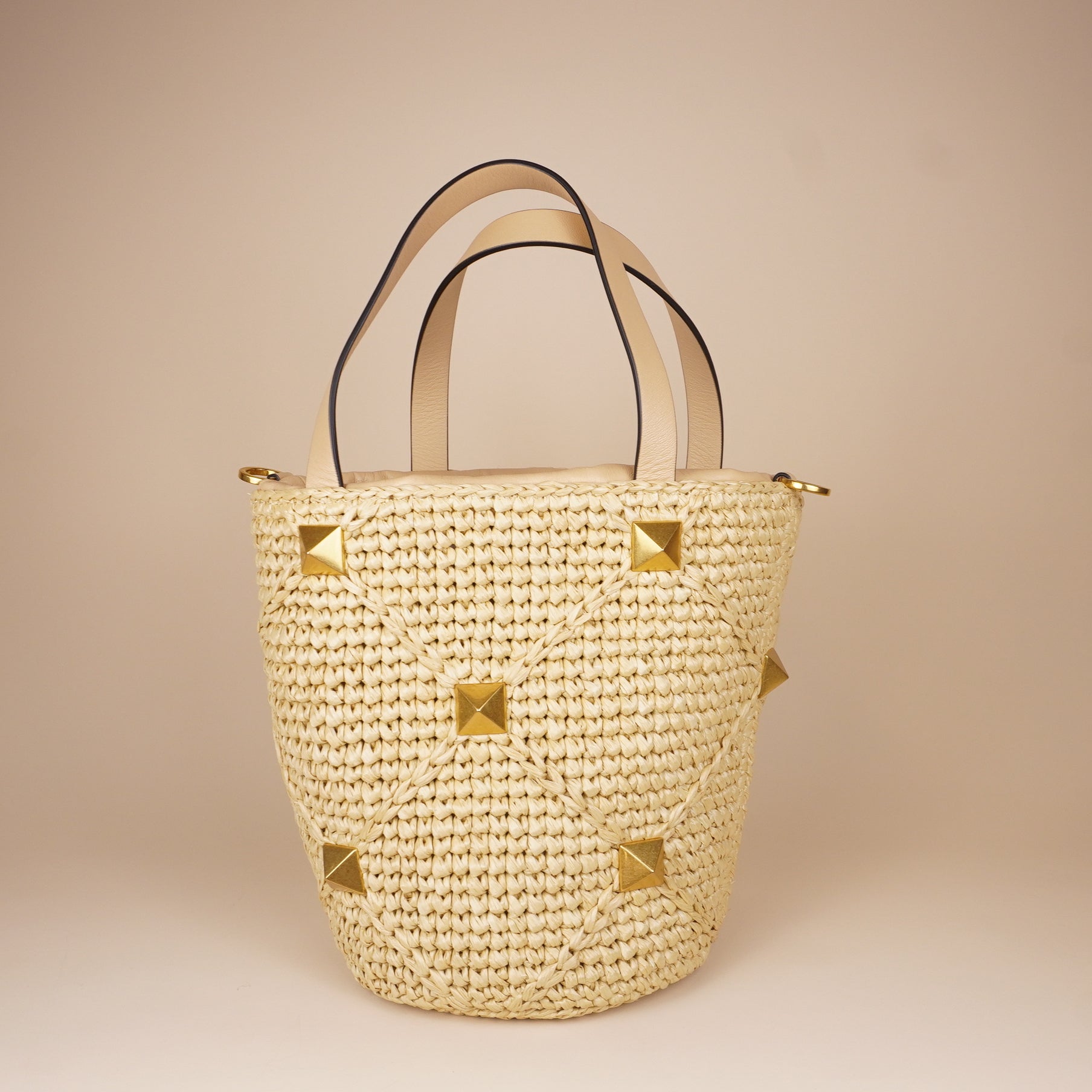 PRE-OWNED Roman Stud Raffia Bucket Bag