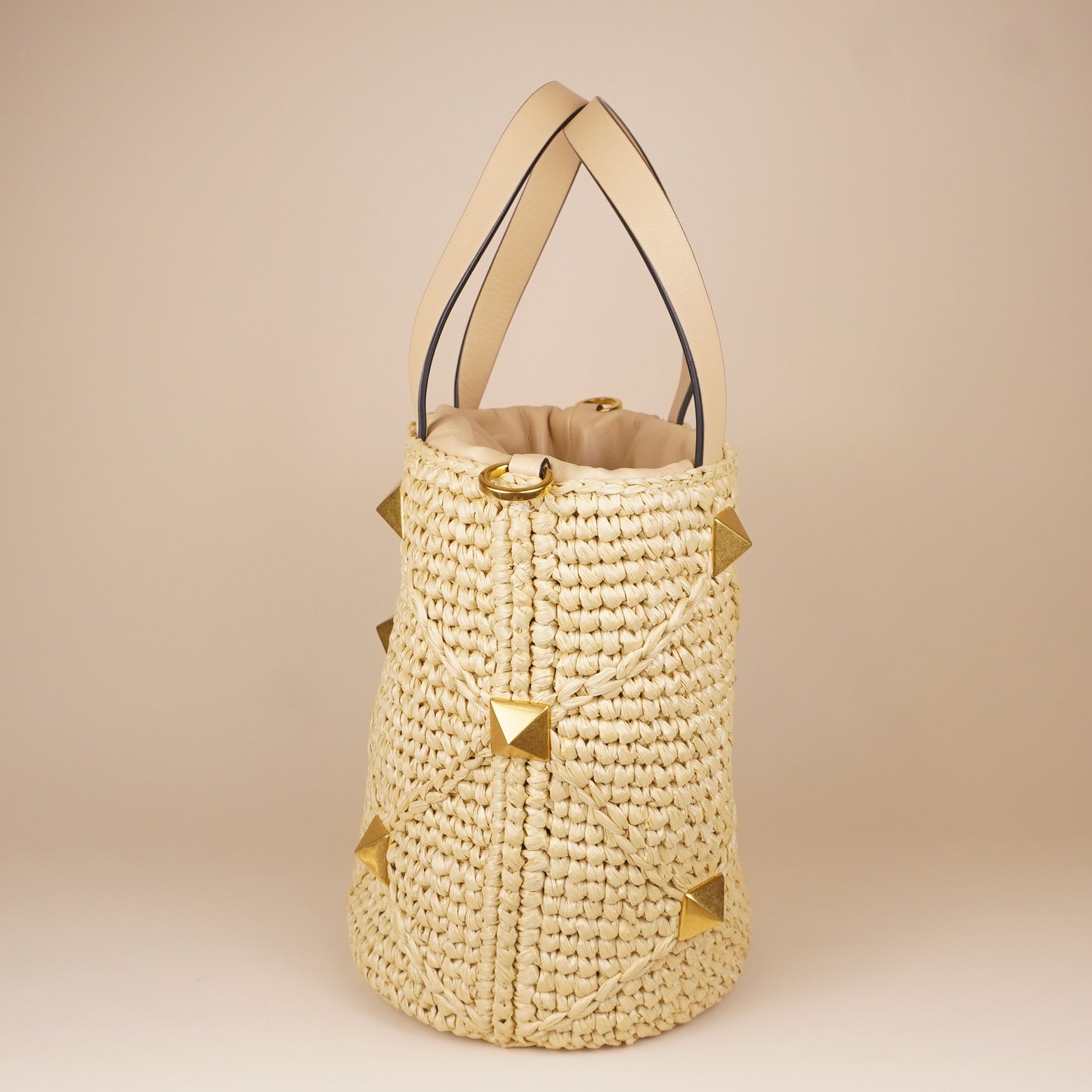 PRE-OWNED Roman Stud Raffia Bucket Bag