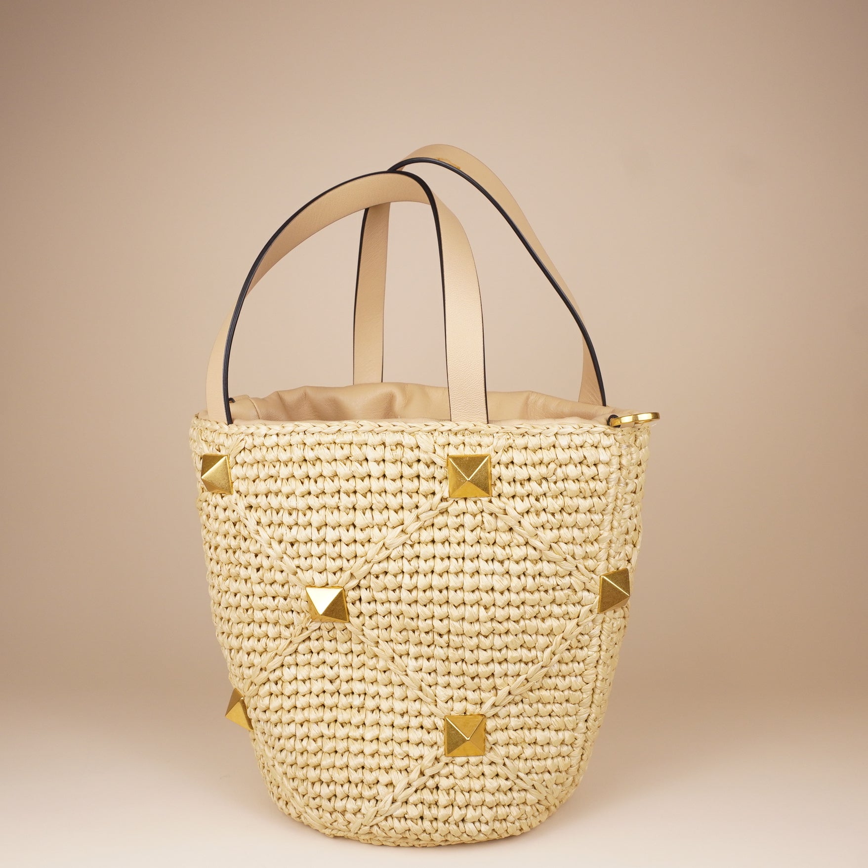 PRE-OWNED Roman Stud Raffia Bucket Bag