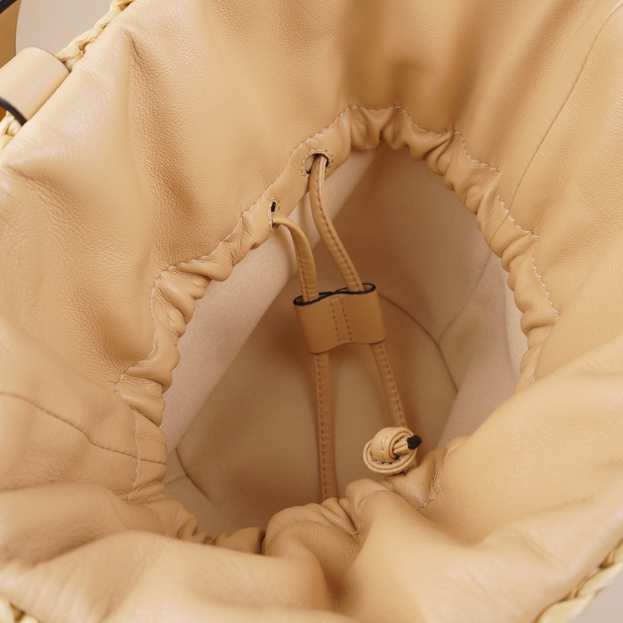 PRE-OWNED Roman Stud Raffia Bucket Bag