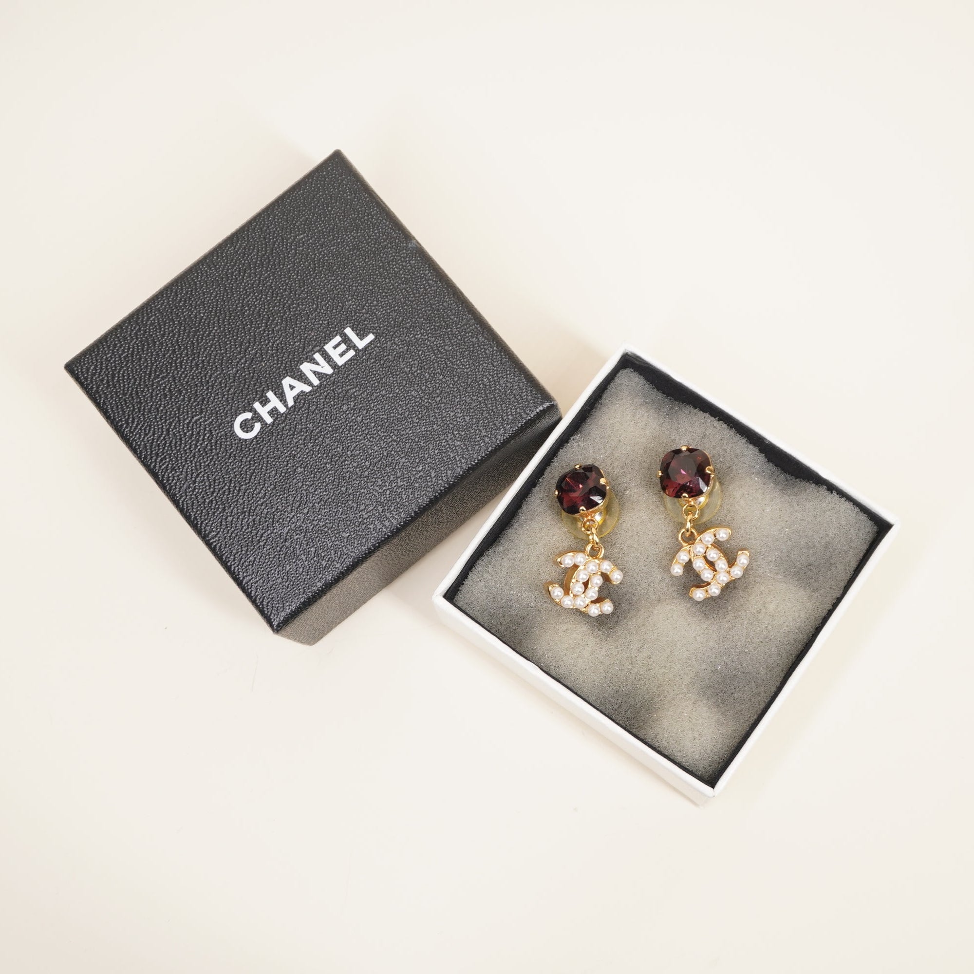 PRE-OWNED CC Drop Earrings with faux pearls and a Crystal
