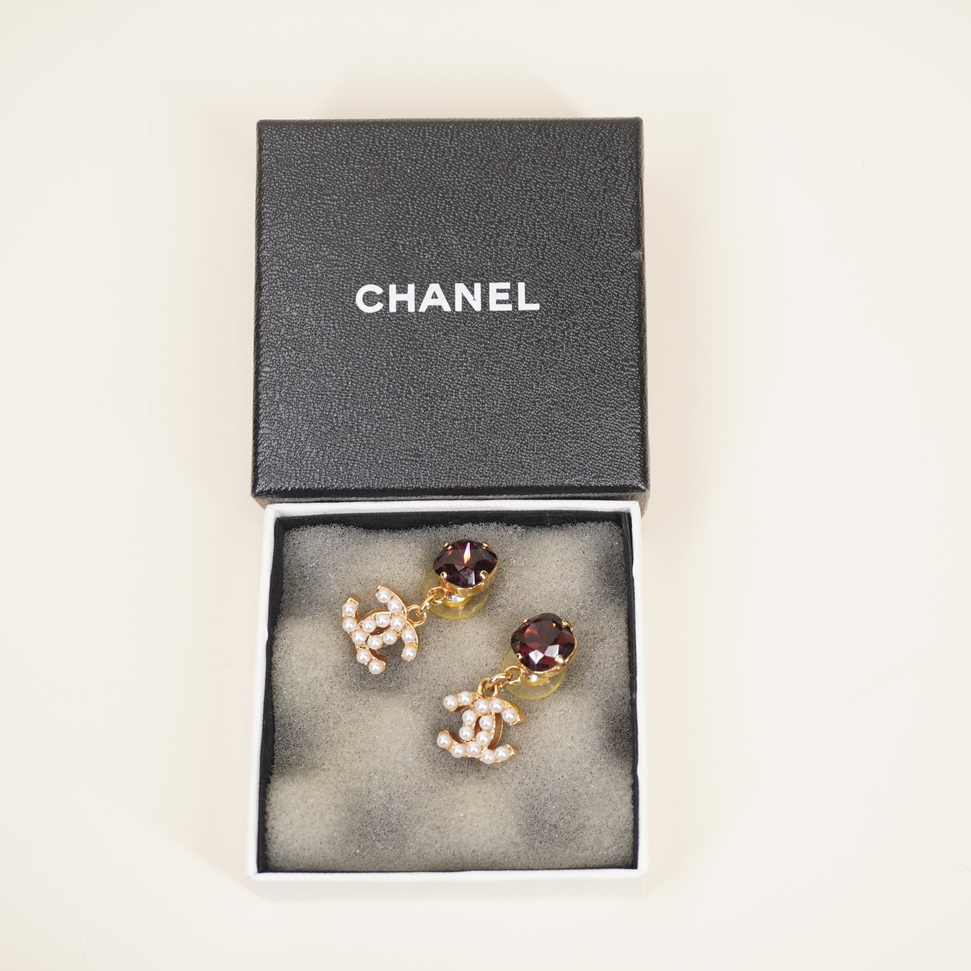 PRE-OWNED CC Drop Earrings with faux pearls and a Crystal