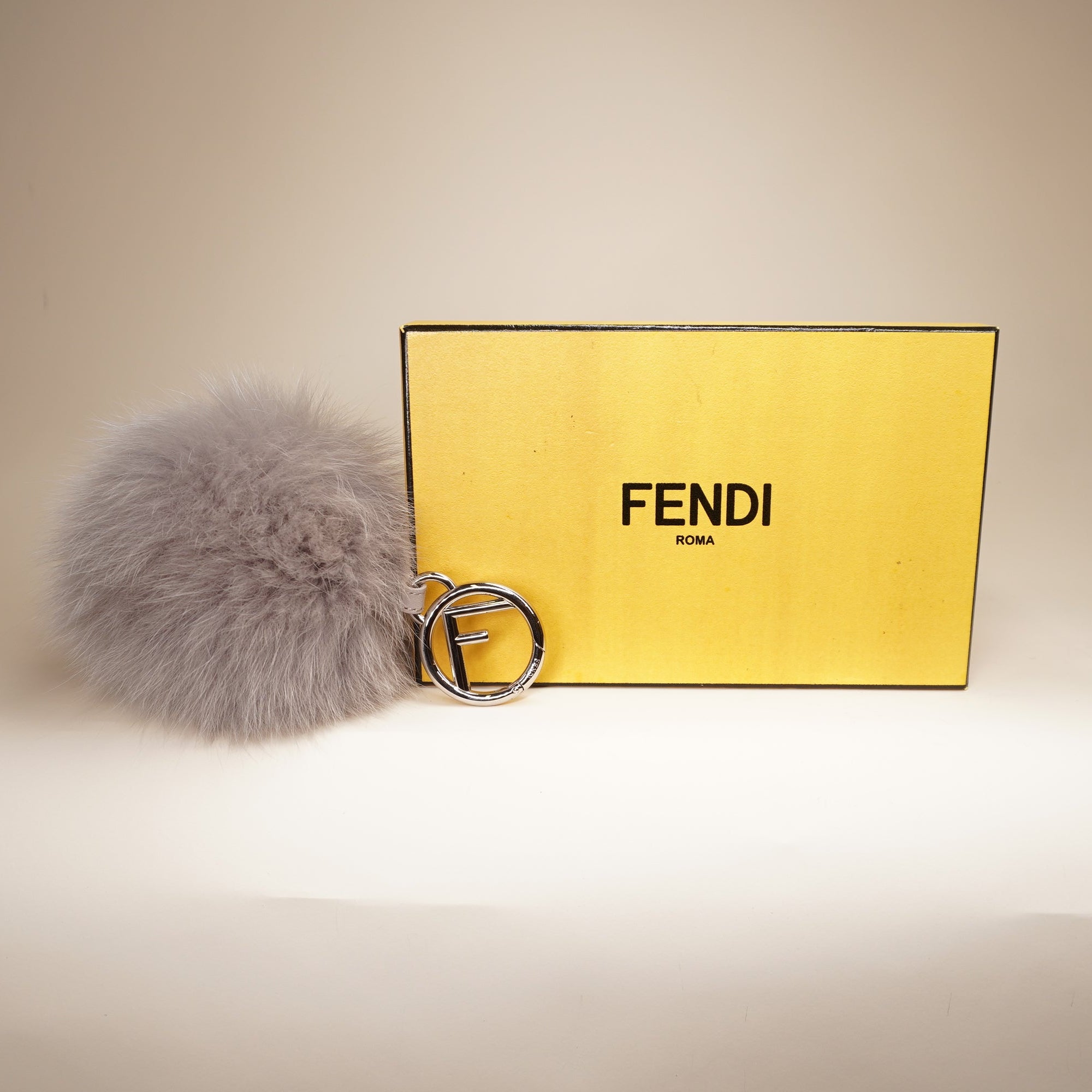 PRE-OWNED Fox Fur Pom Pom Bag Charm Grey