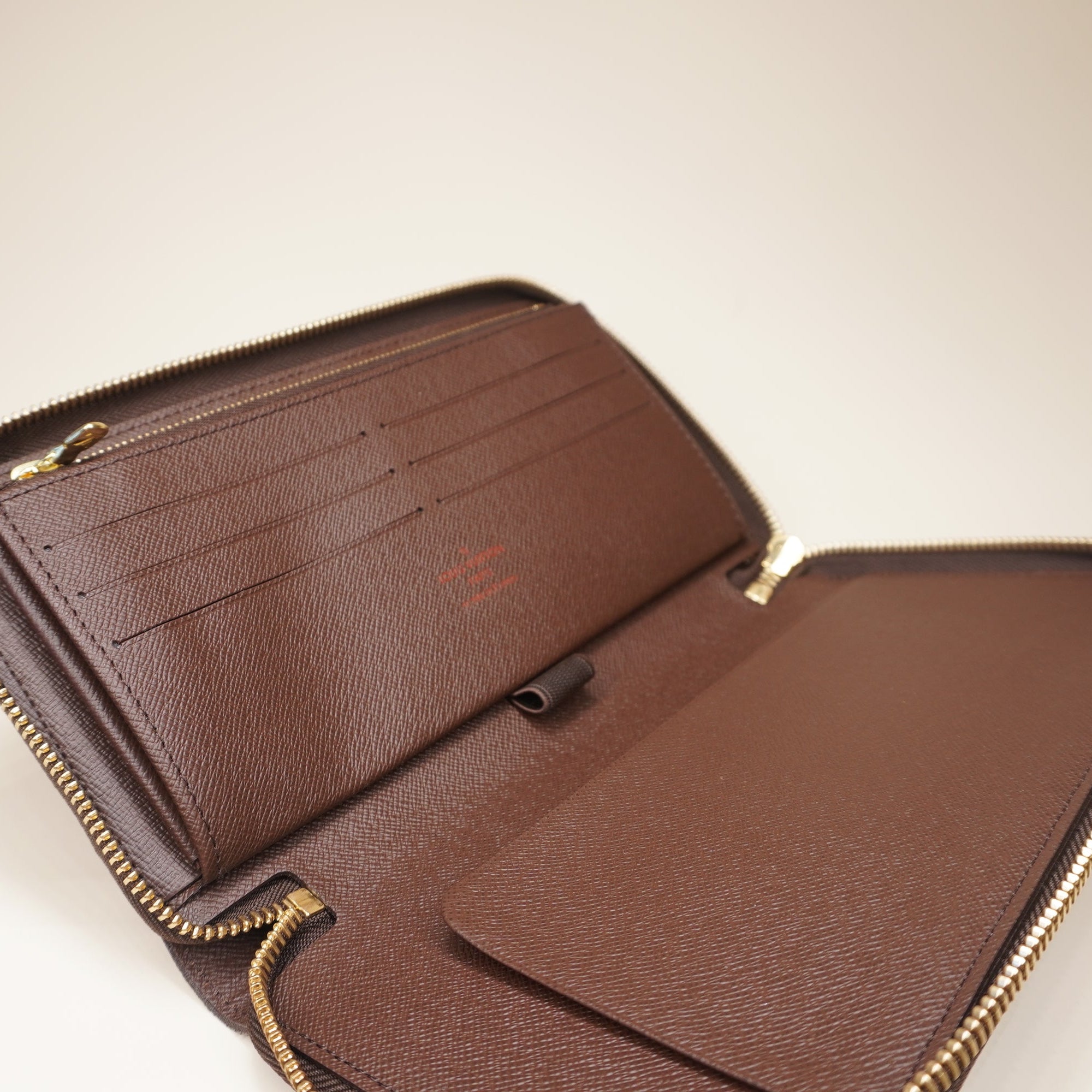 PRE-OWNED LV Damier Ebene Canvas Zippy Organizer Wallet