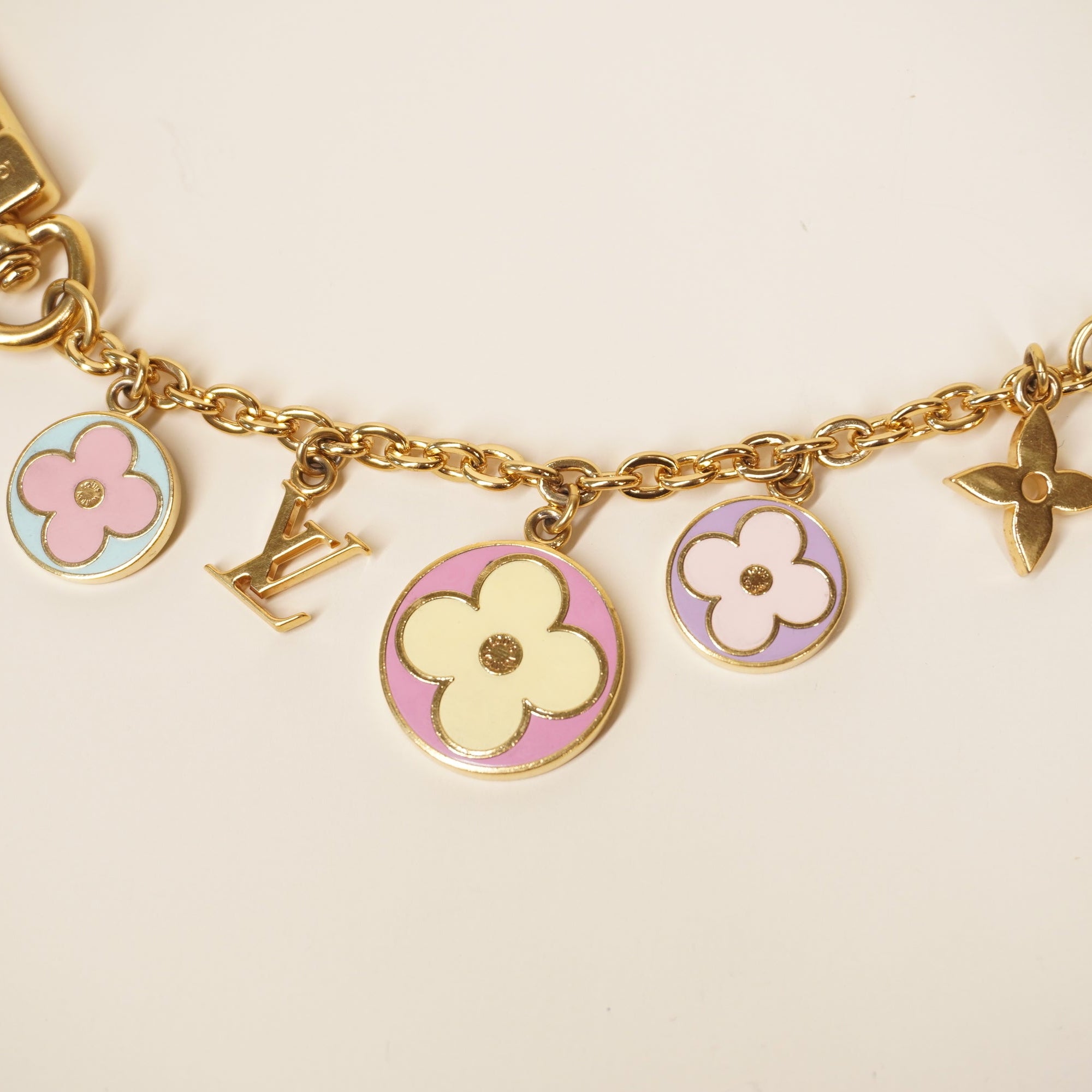 PRE-OWNED LV  Gold Flour Long Bag Charm