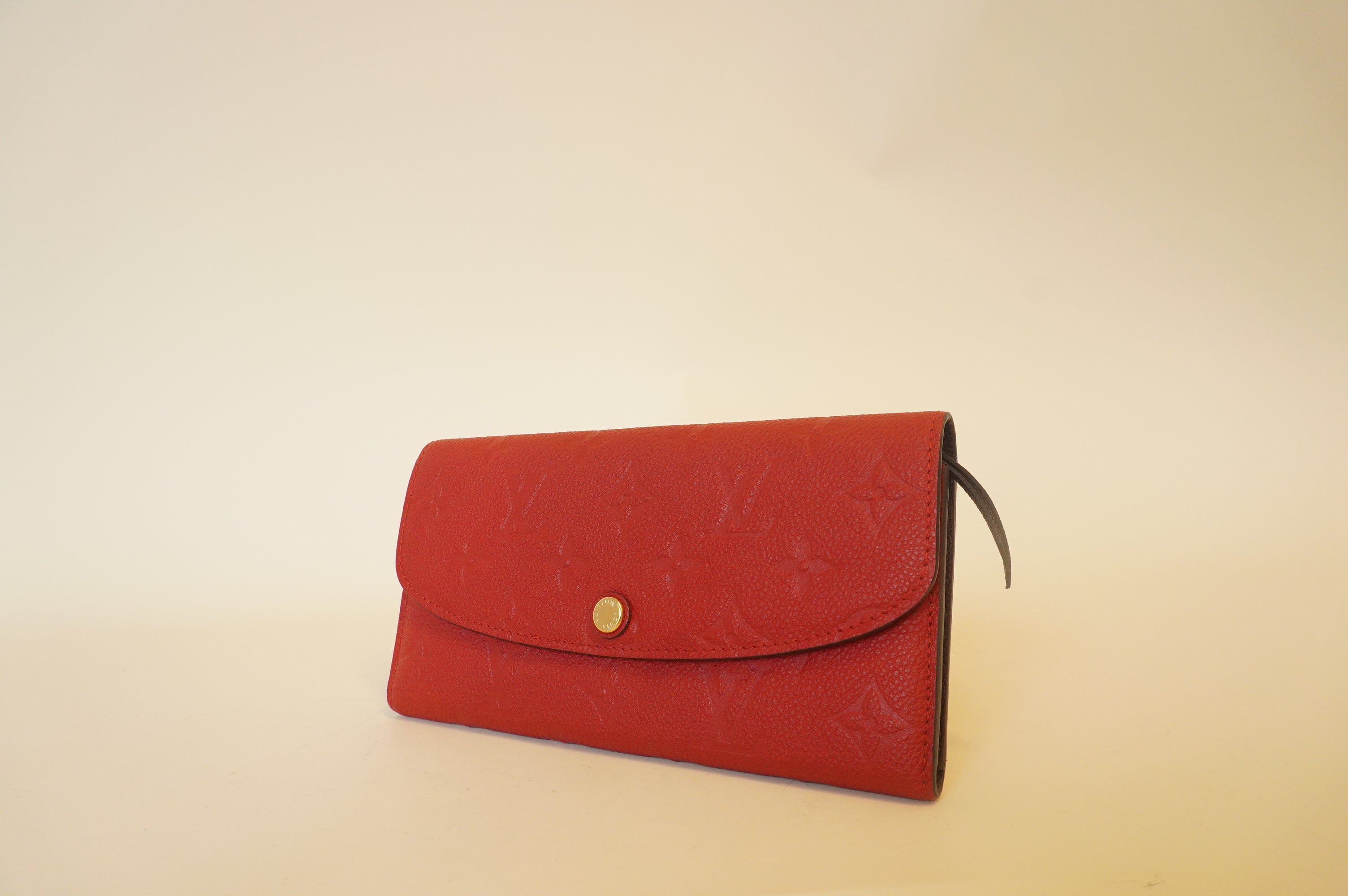 Cartera larga Empreinte Emilie con monograma rojo de segunda mano