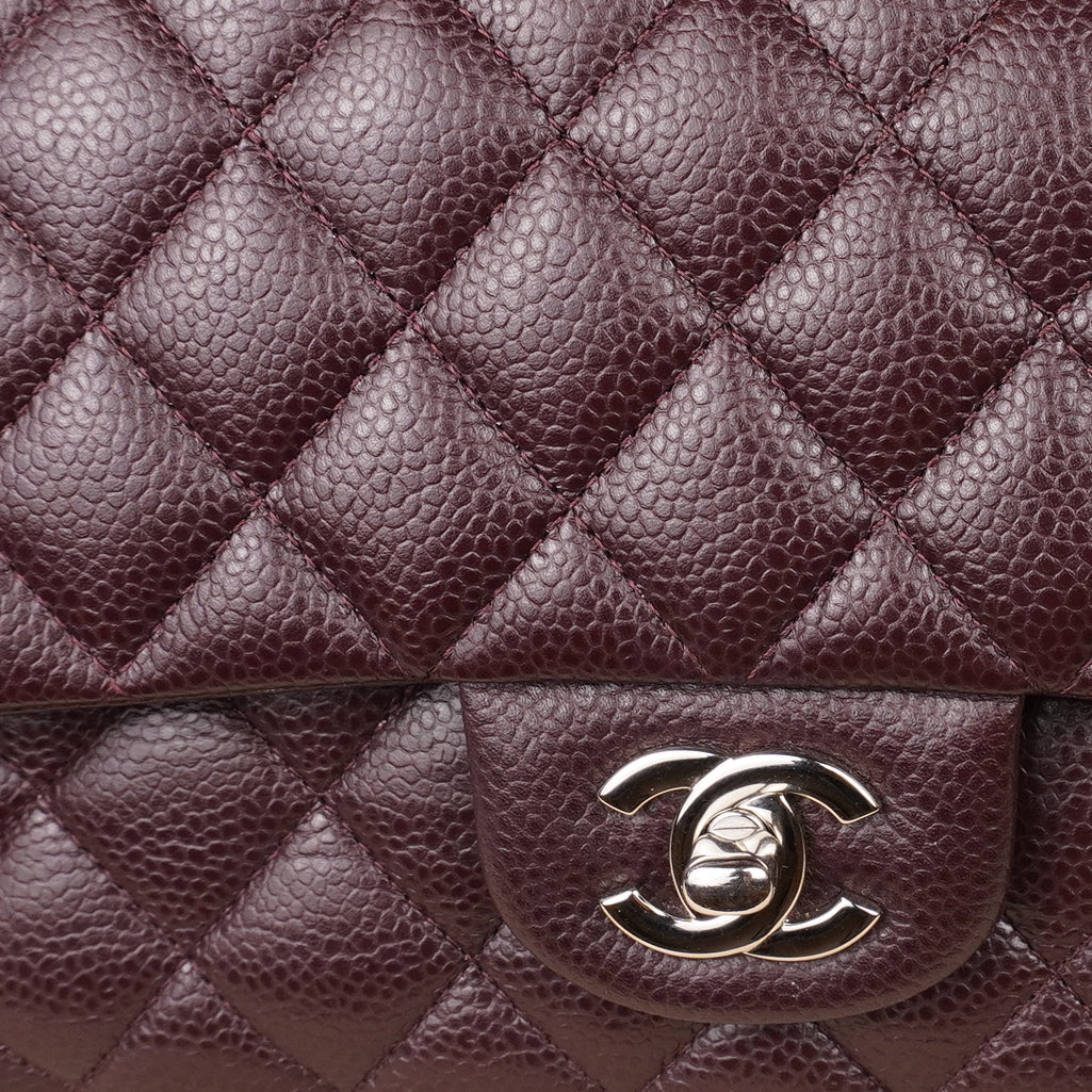PRE-OWNED CC Brown Quilted Caviar Leather Medium Classic Double Flap Bag