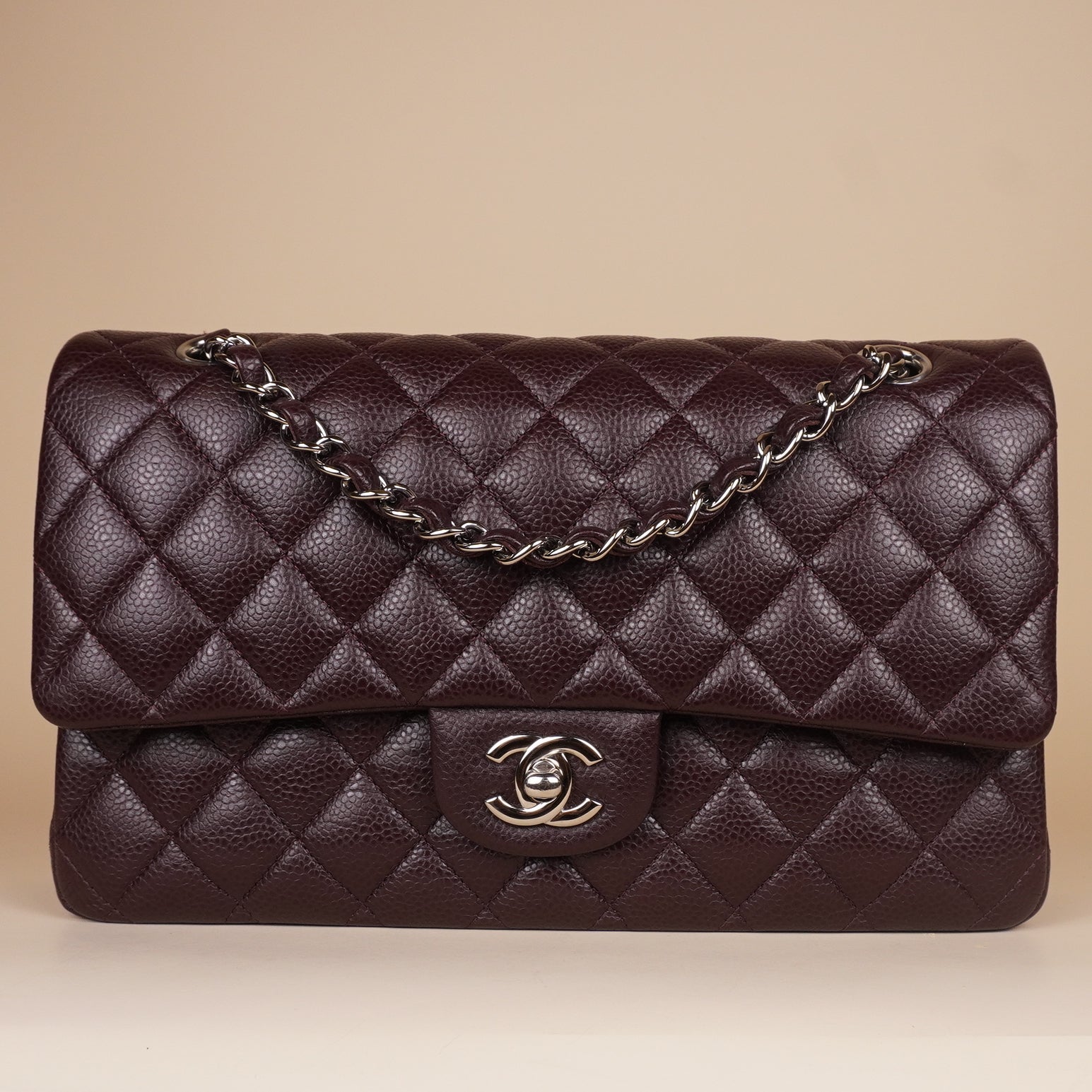 PRE-OWNED CC Brown Quilted Caviar Leather Medium Classic Double Flap Bag