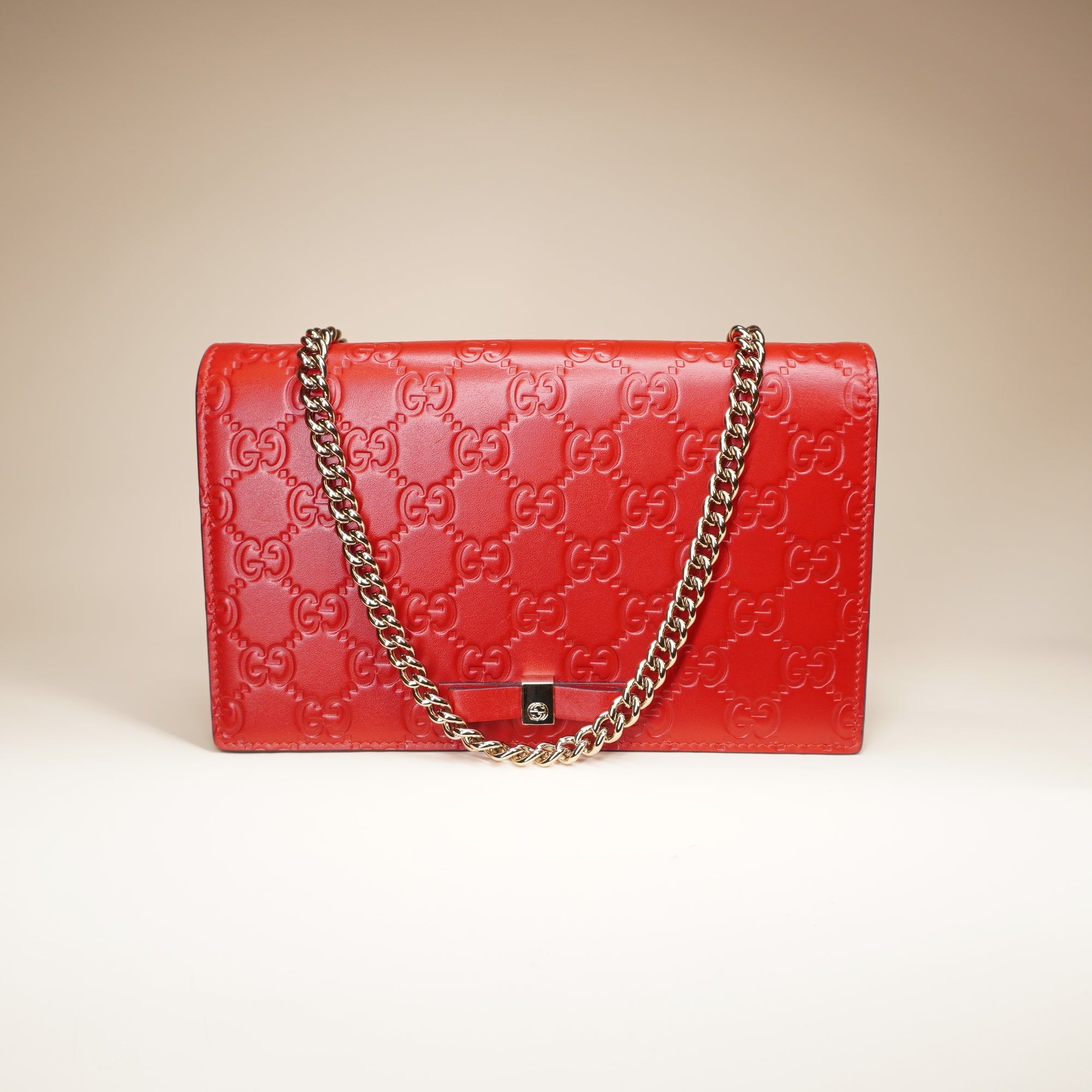 PRE-OWNED Hibiscus Red Guccissima Leather Signature WOC