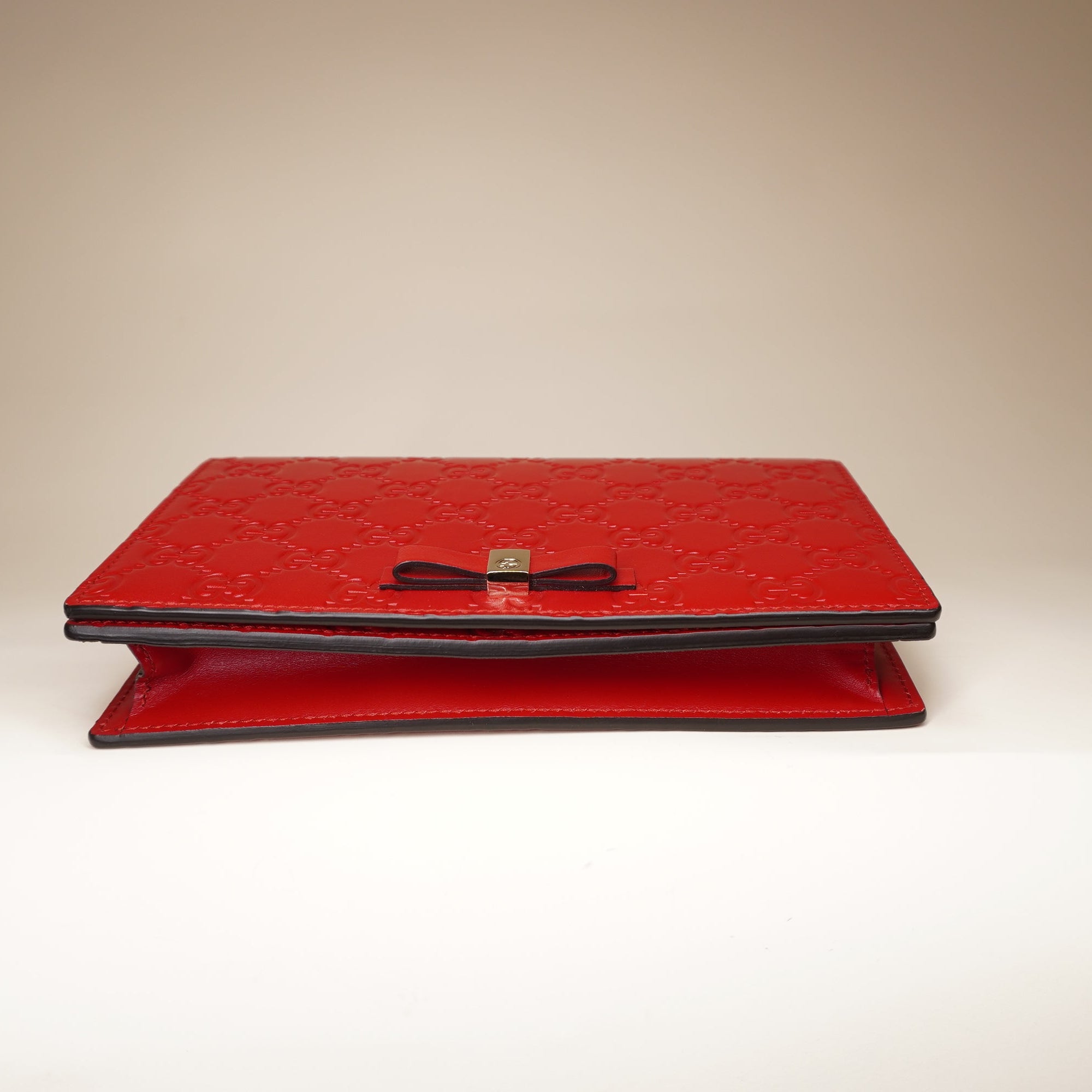 PRE-OWNED Hibiscus Red Guccissima Leather Signature WOC