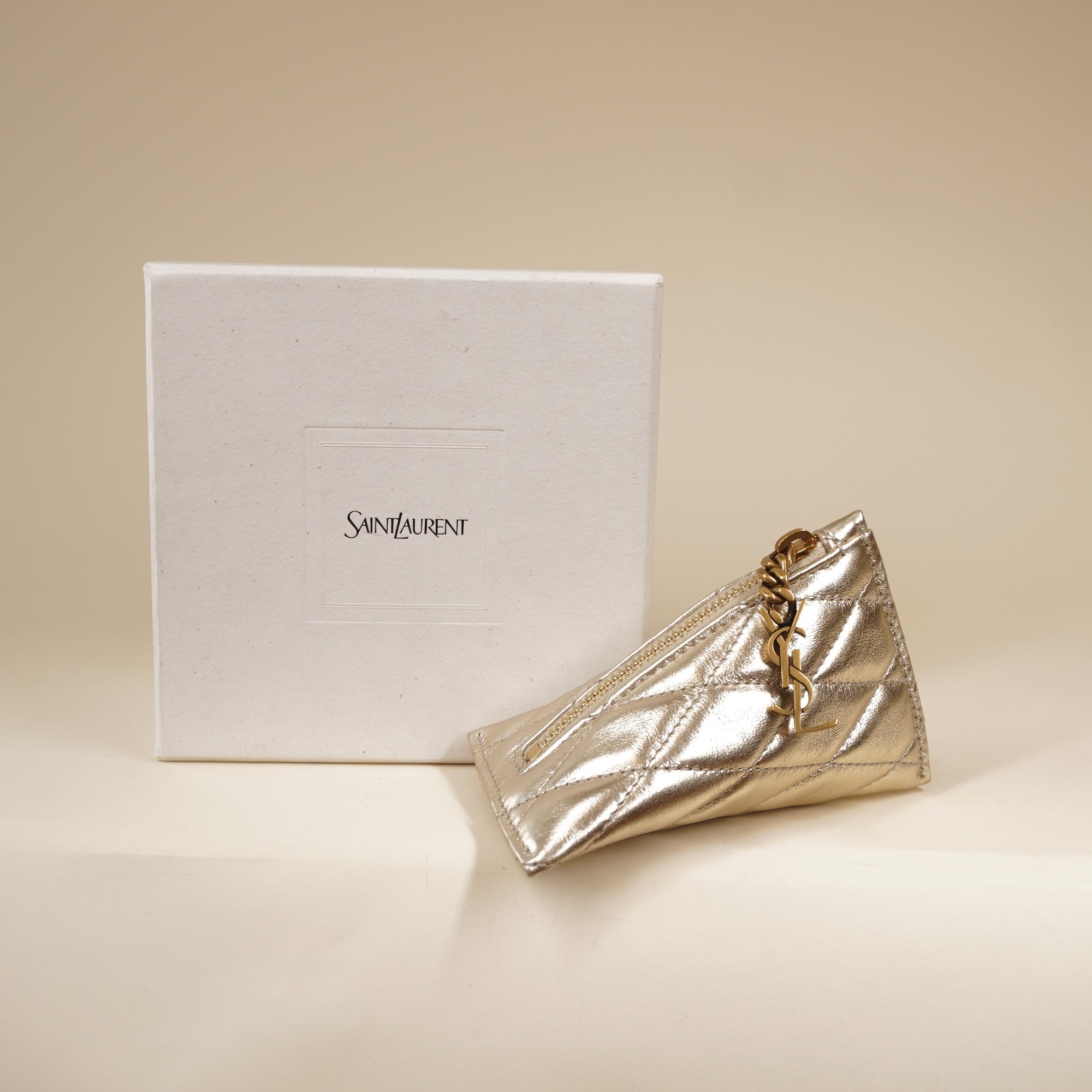 PRE-OWNED Metallic Calfskin Berlingo Bag Charm Champagne Gold