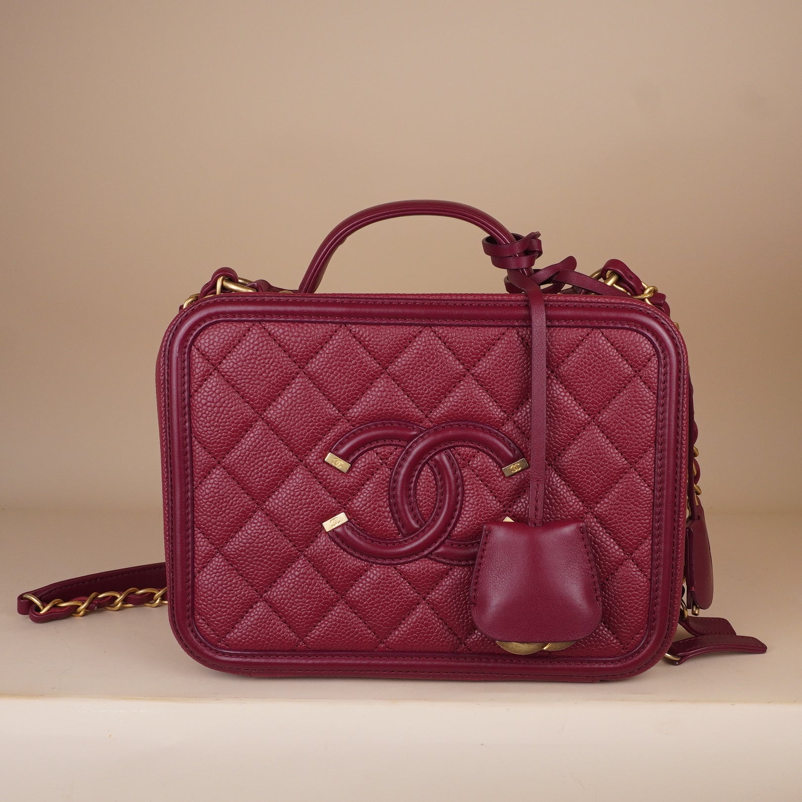 PRE-OWNED CC Burgundy Caviar Quilted Medium CC Filigree Vanity Case Shoulder Bag