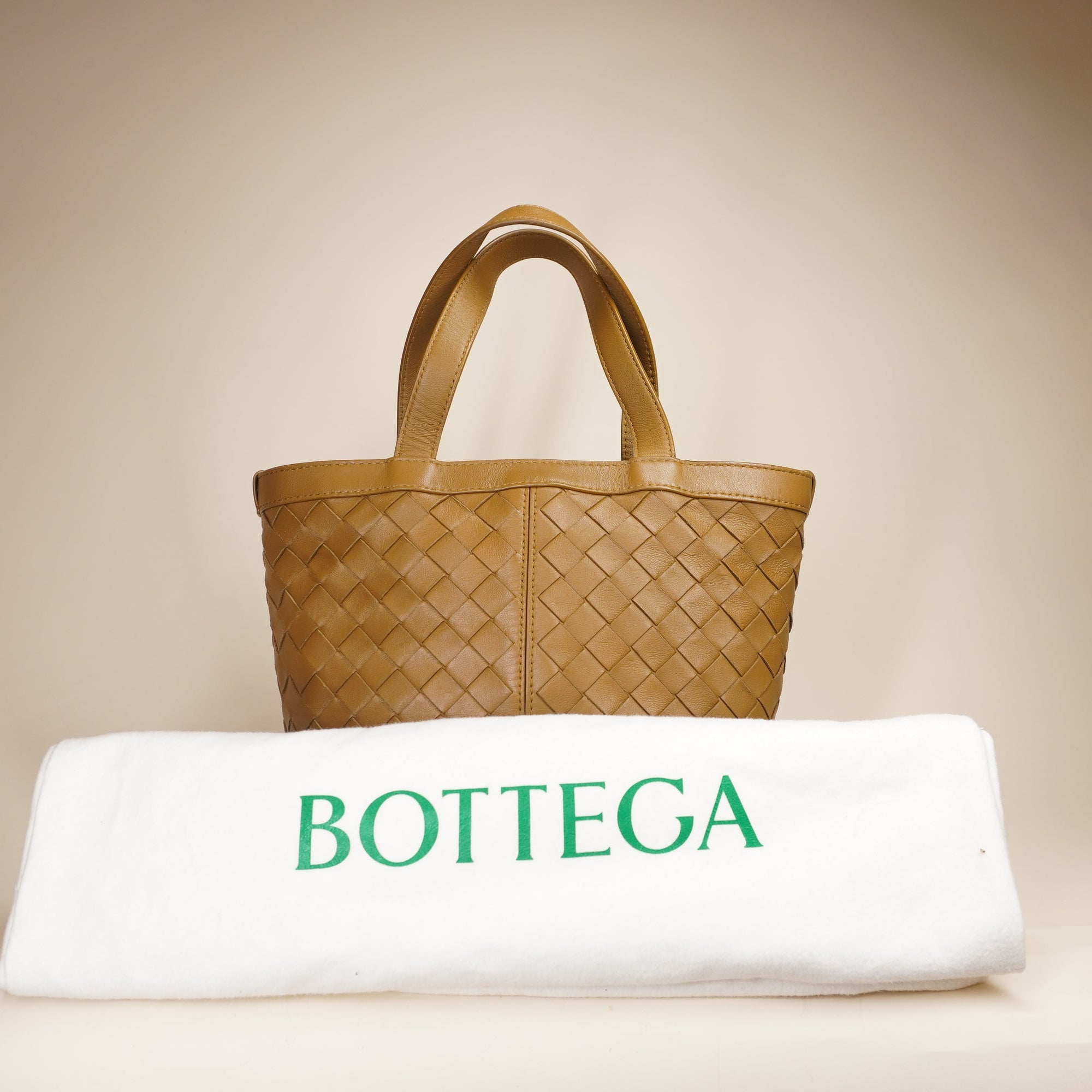 PRE-OWNED Small Flip Flap Tote in Intrecciato Leather Shoulder Bag
