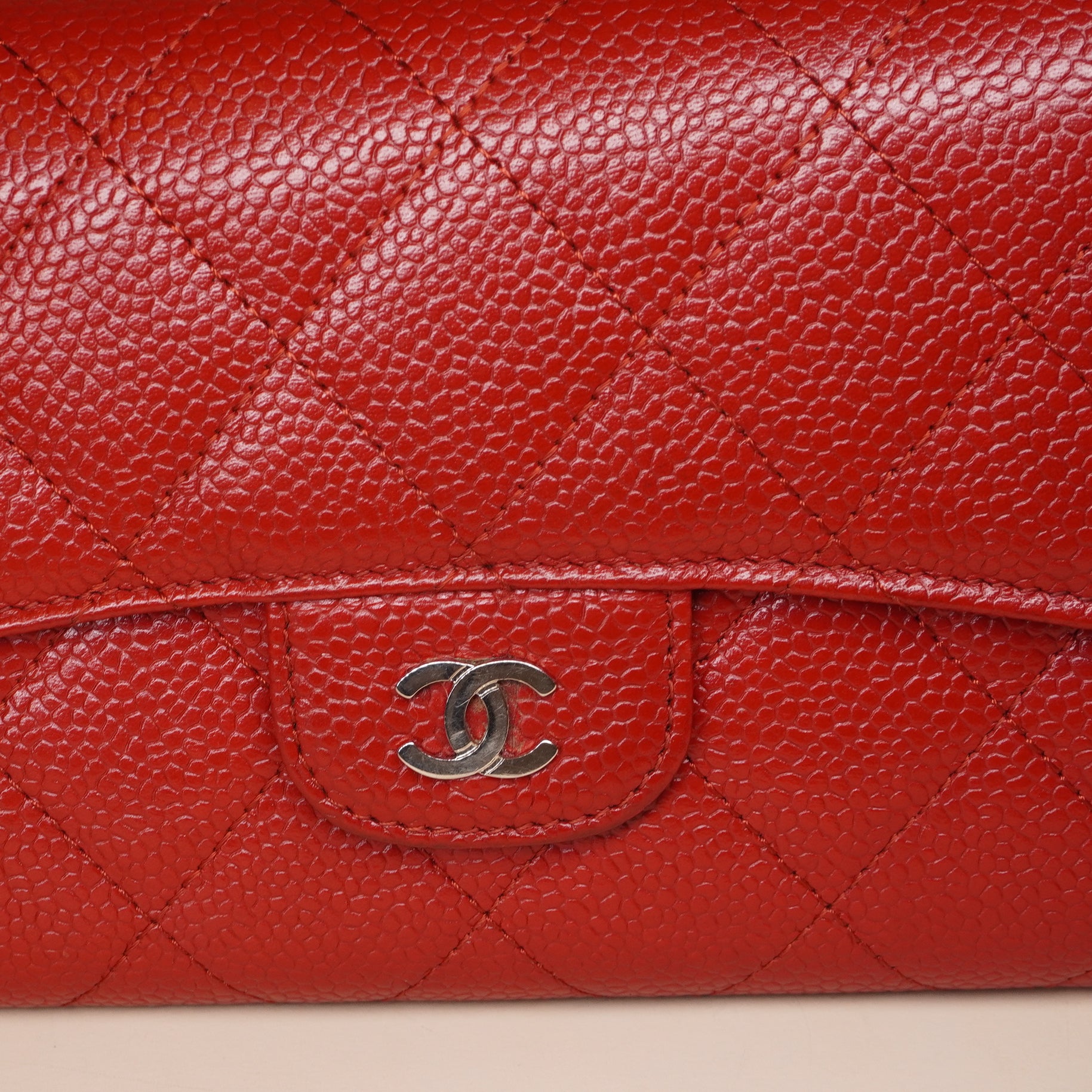 PRE-OWNED CC Red Quilted Caviar Leather Classic Flap Wallet