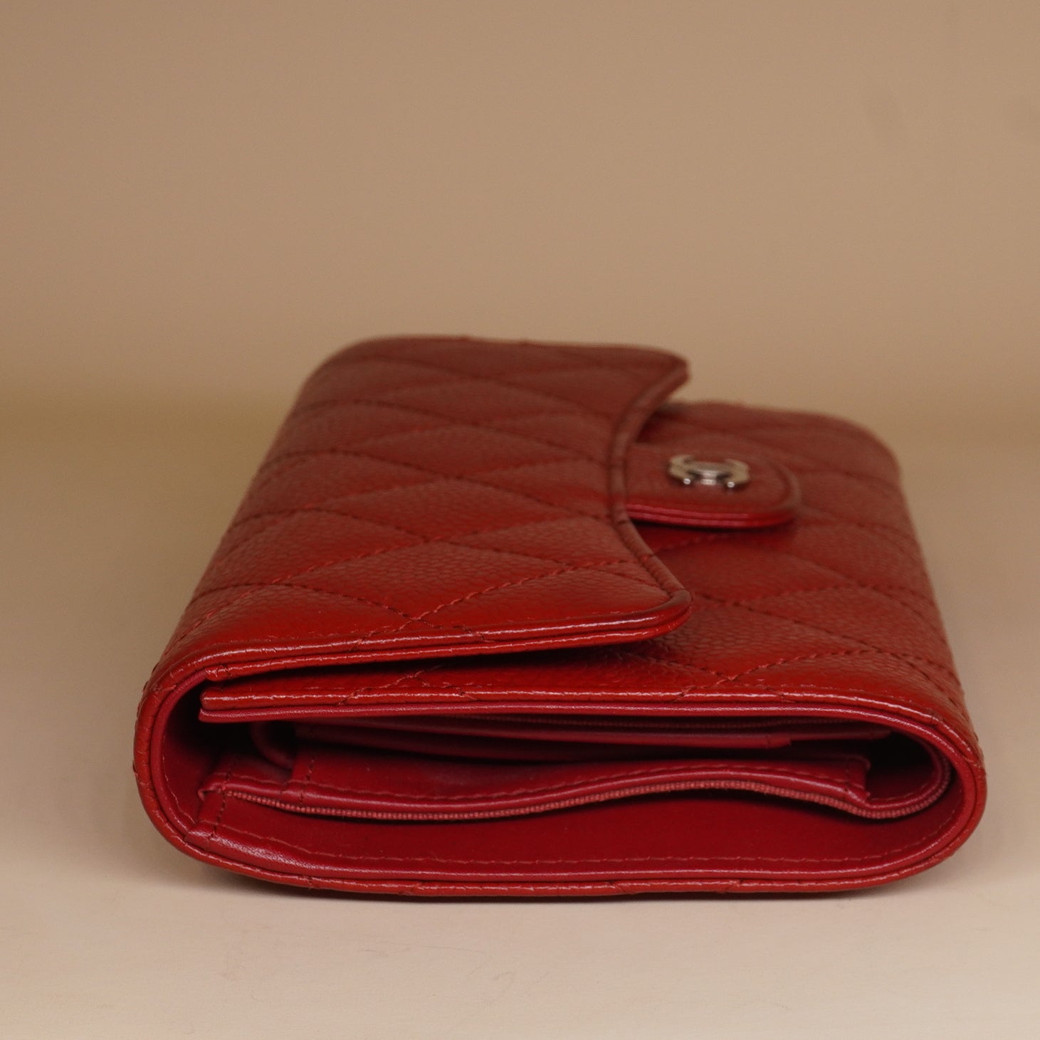PRE-OWNED CC Red Quilted Caviar Leather Classic Flap Wallet