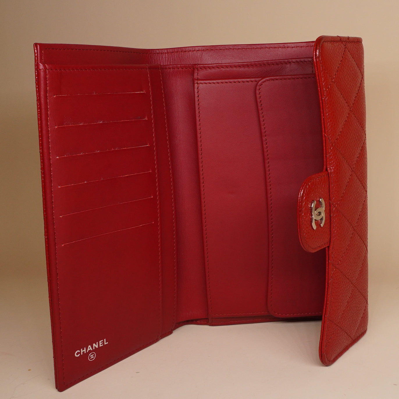PRE-OWNED CC Red Quilted Caviar Leather Classic Flap Wallet