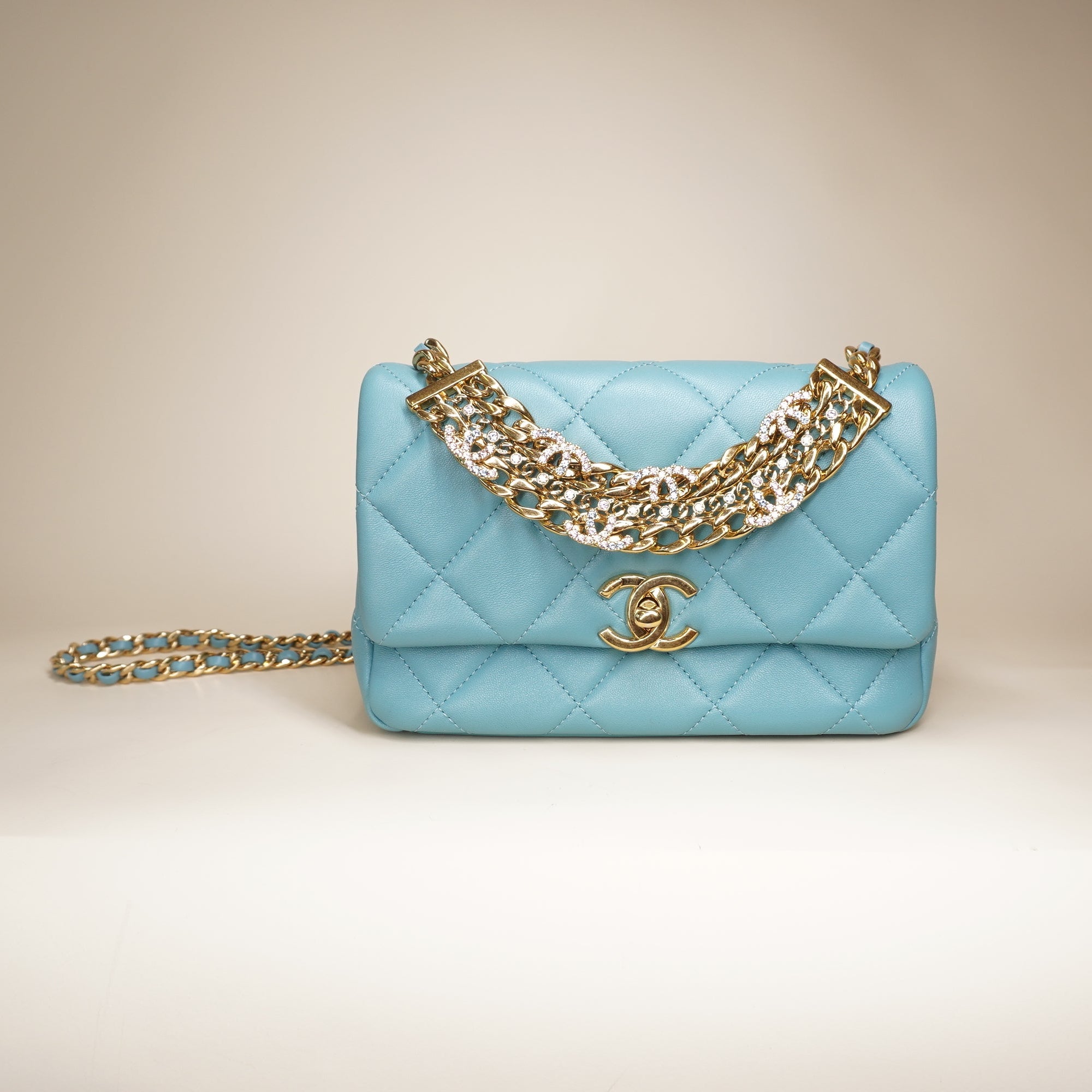 PRE-OWNED Blue Quilted Lambskin Leather Mini CC Crystal Logo Chain Flap Bag