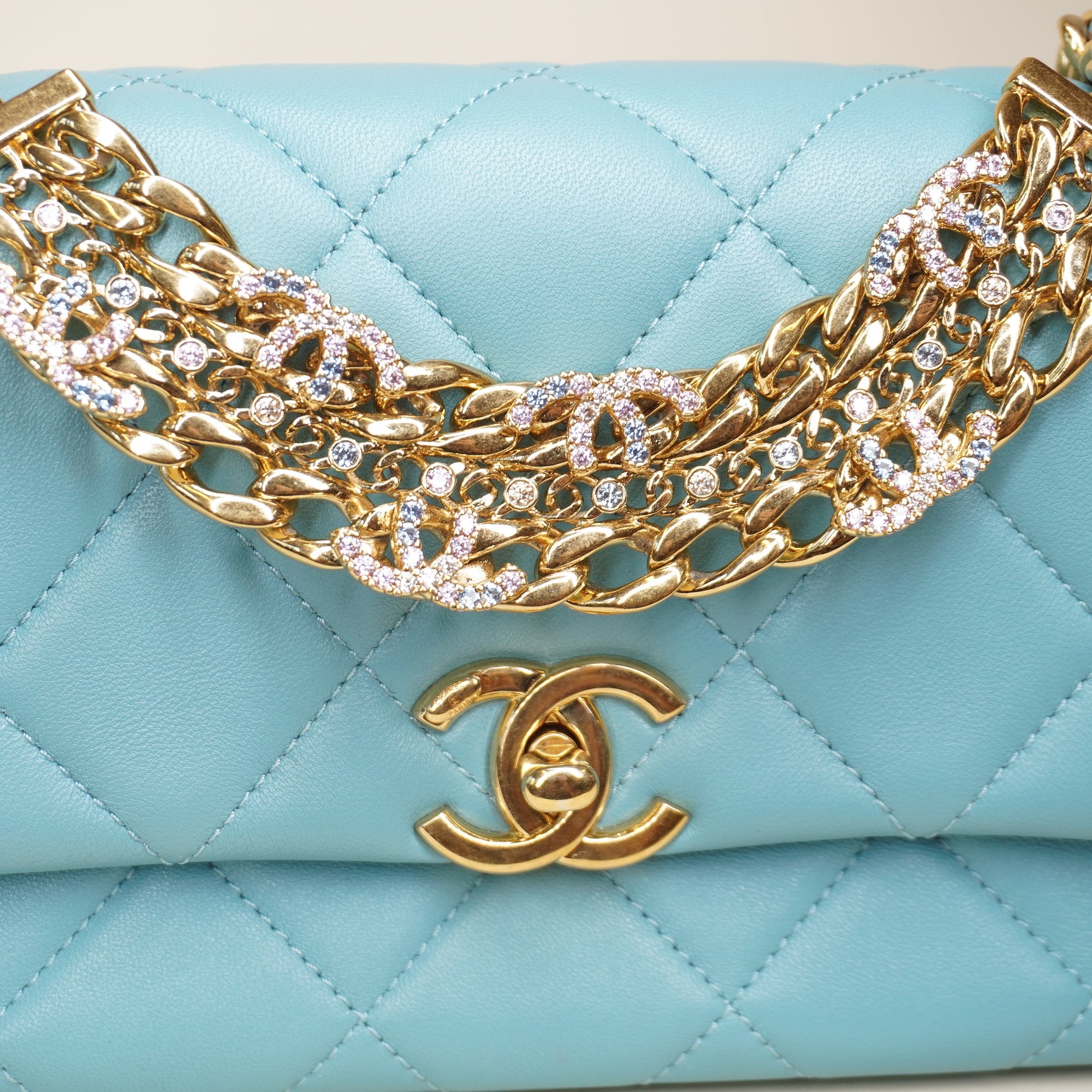 PRE-OWNED Blue Quilted Lambskin Leather Mini CC Crystal Logo Chain Flap Bag