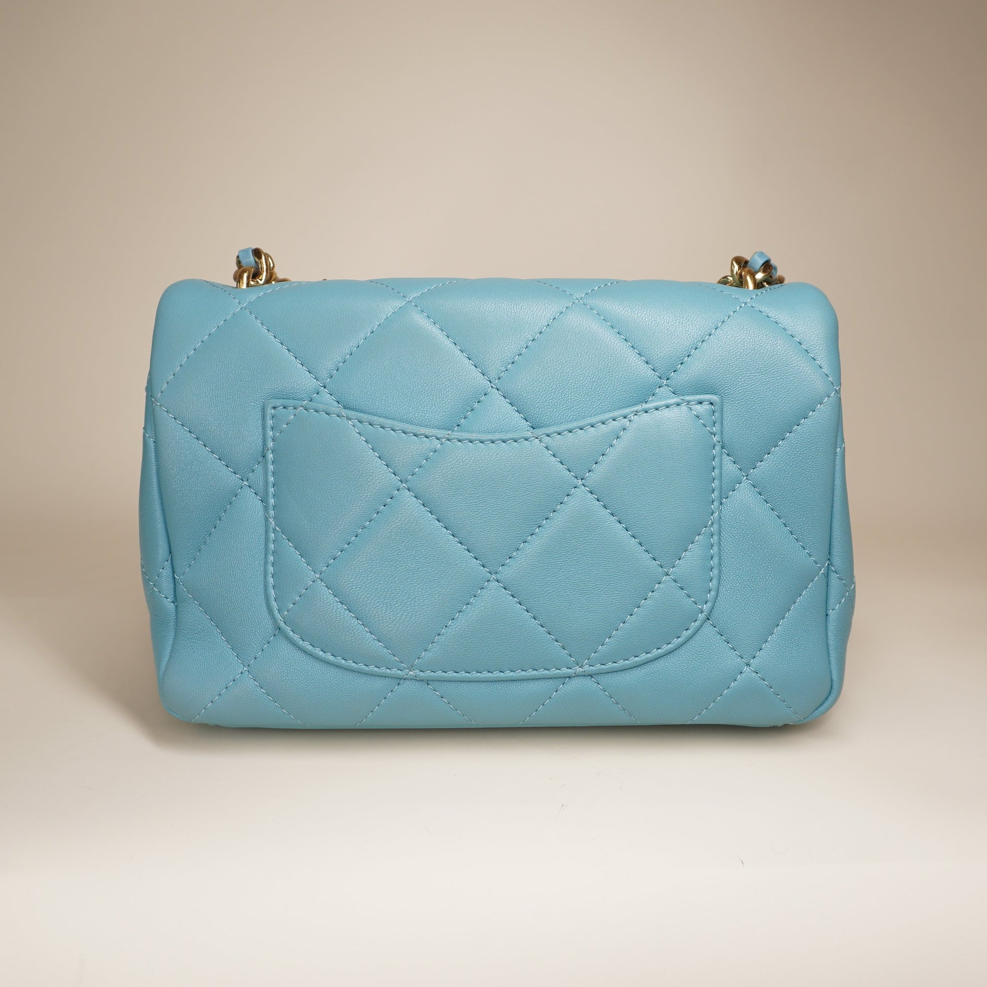 PRE-OWNED Blue Quilted Lambskin Leather Mini CC Crystal Logo Chain Flap Bag