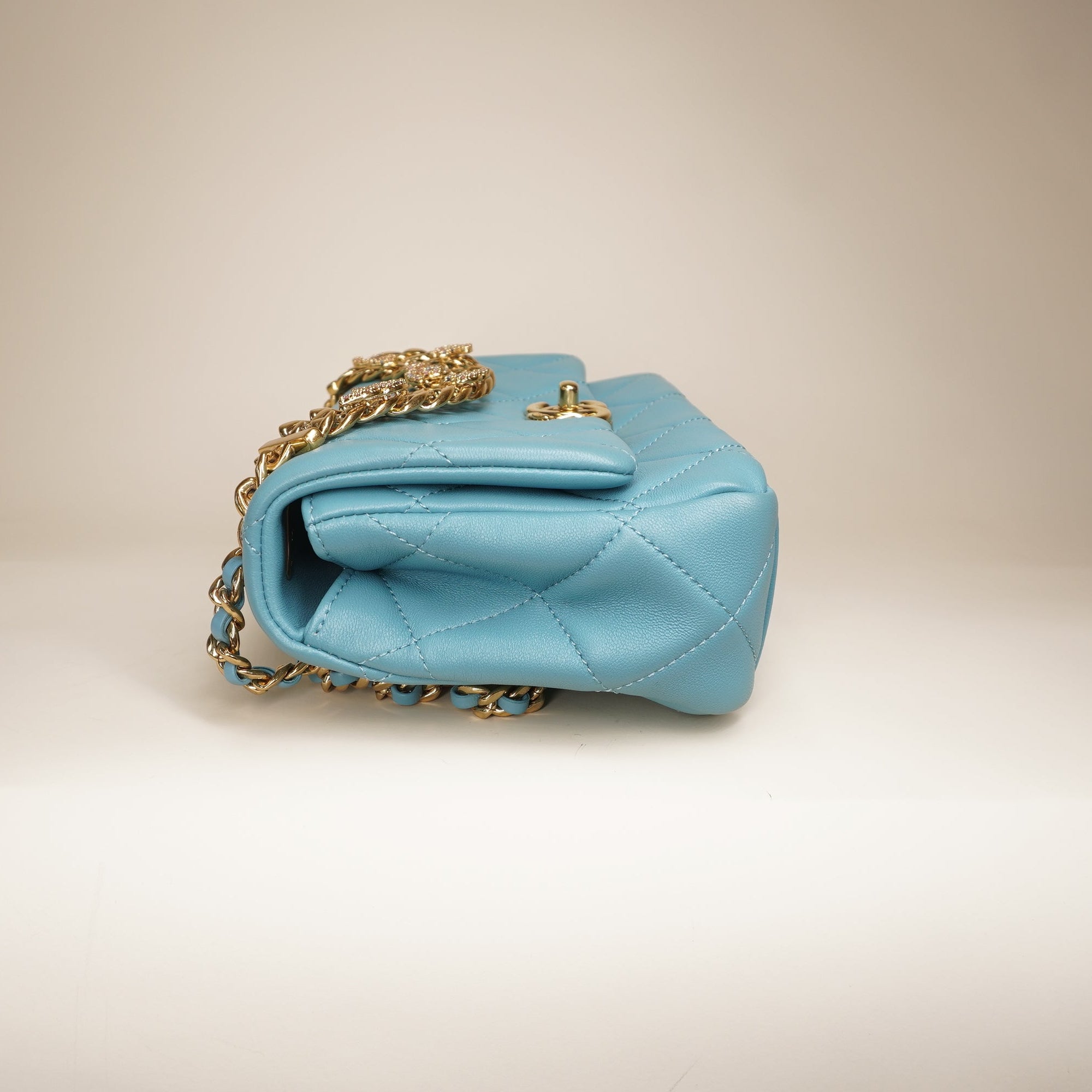 PRE-OWNED Blue Quilted Lambskin Leather Mini CC Crystal Logo Chain Flap Bag