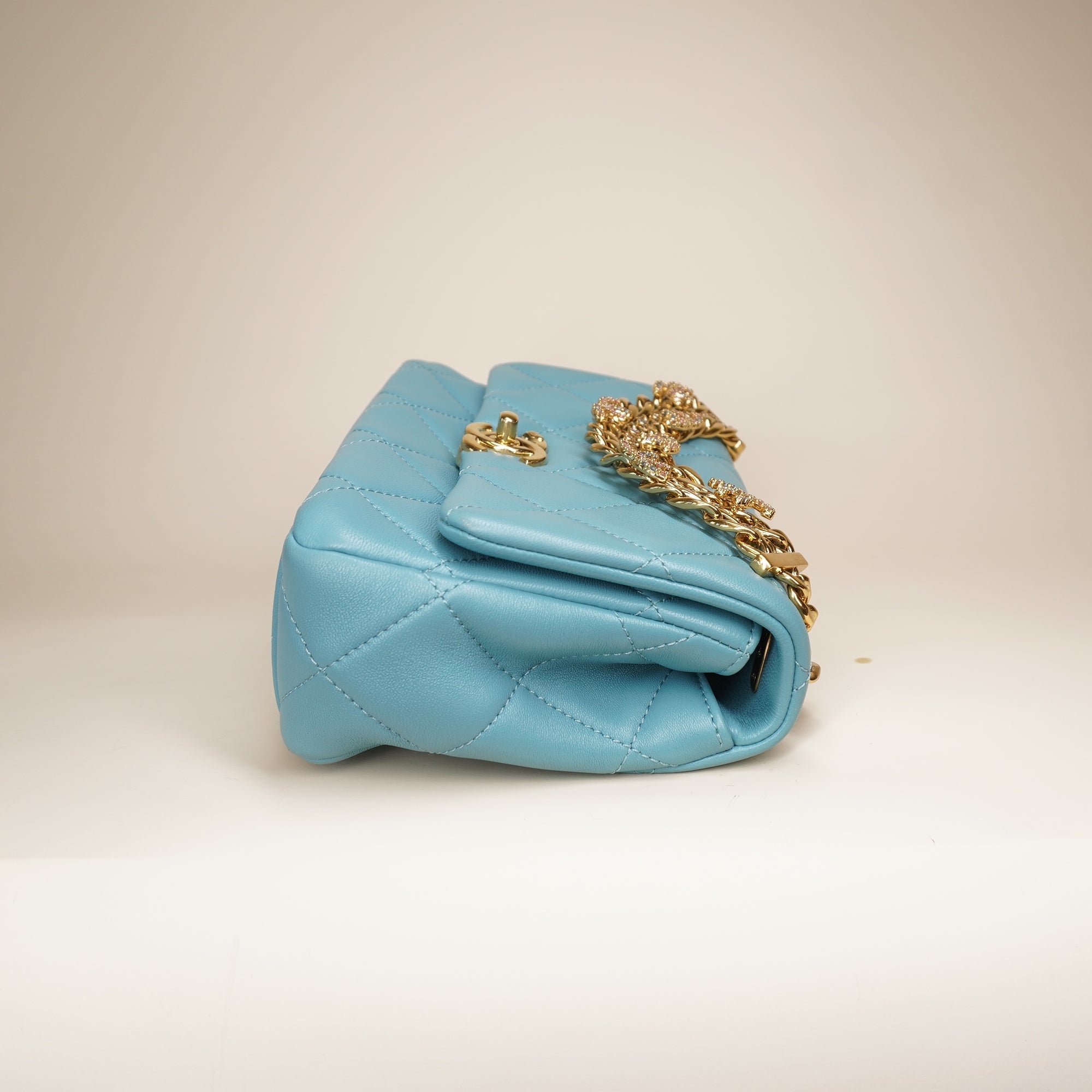 PRE-OWNED Blue Quilted Lambskin Leather Mini CC Crystal Logo Chain Flap Bag